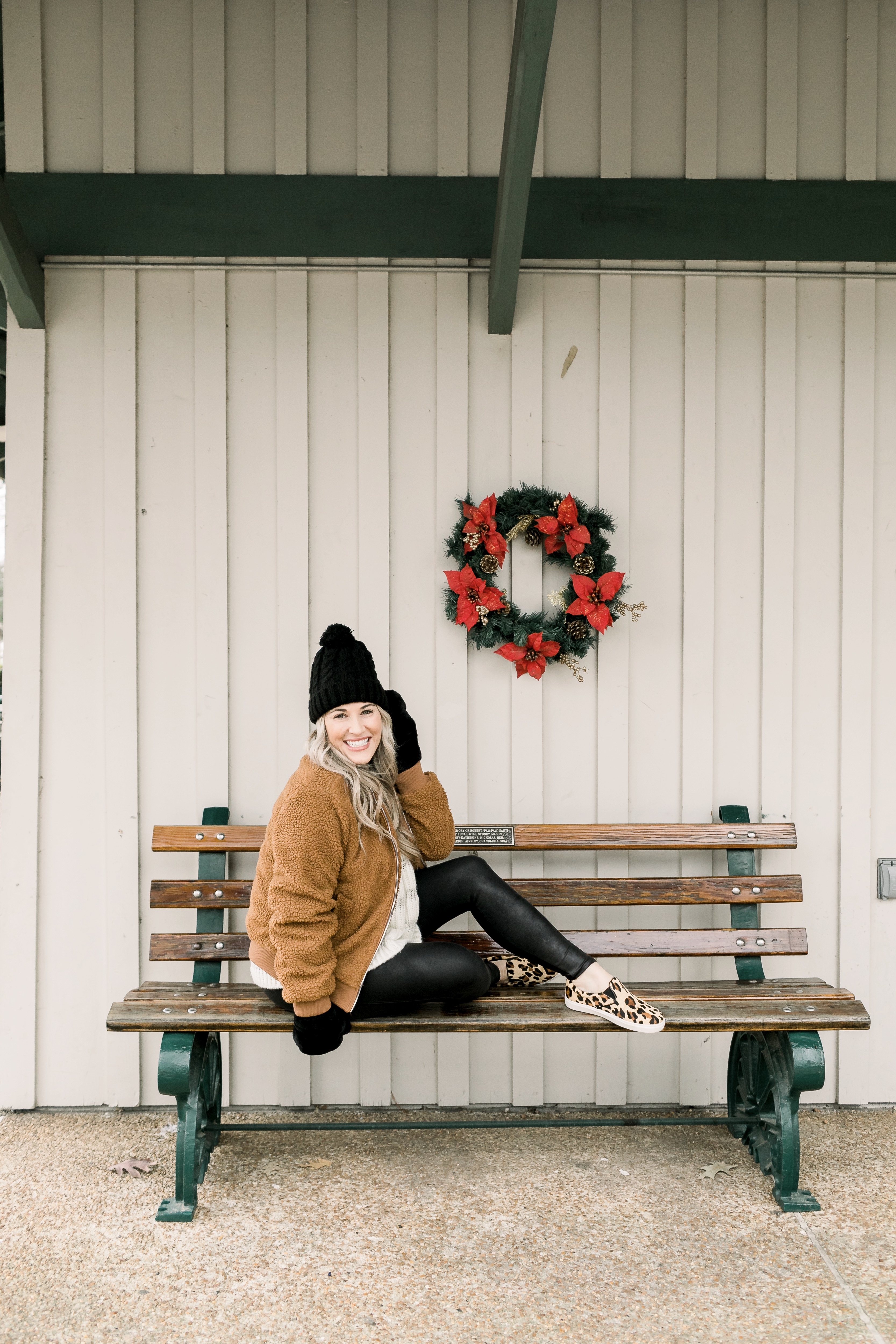 Cozy winter look styled by top US fashion blog, Walking in Memphis in High Heels: image of a woman wearing a Free People cropped sweater, New York Accessory Group pom beanie, Love + Joy teddy bear jacket, Kohl’s faux fur mittens, and Steve Madden leopard sneakers.