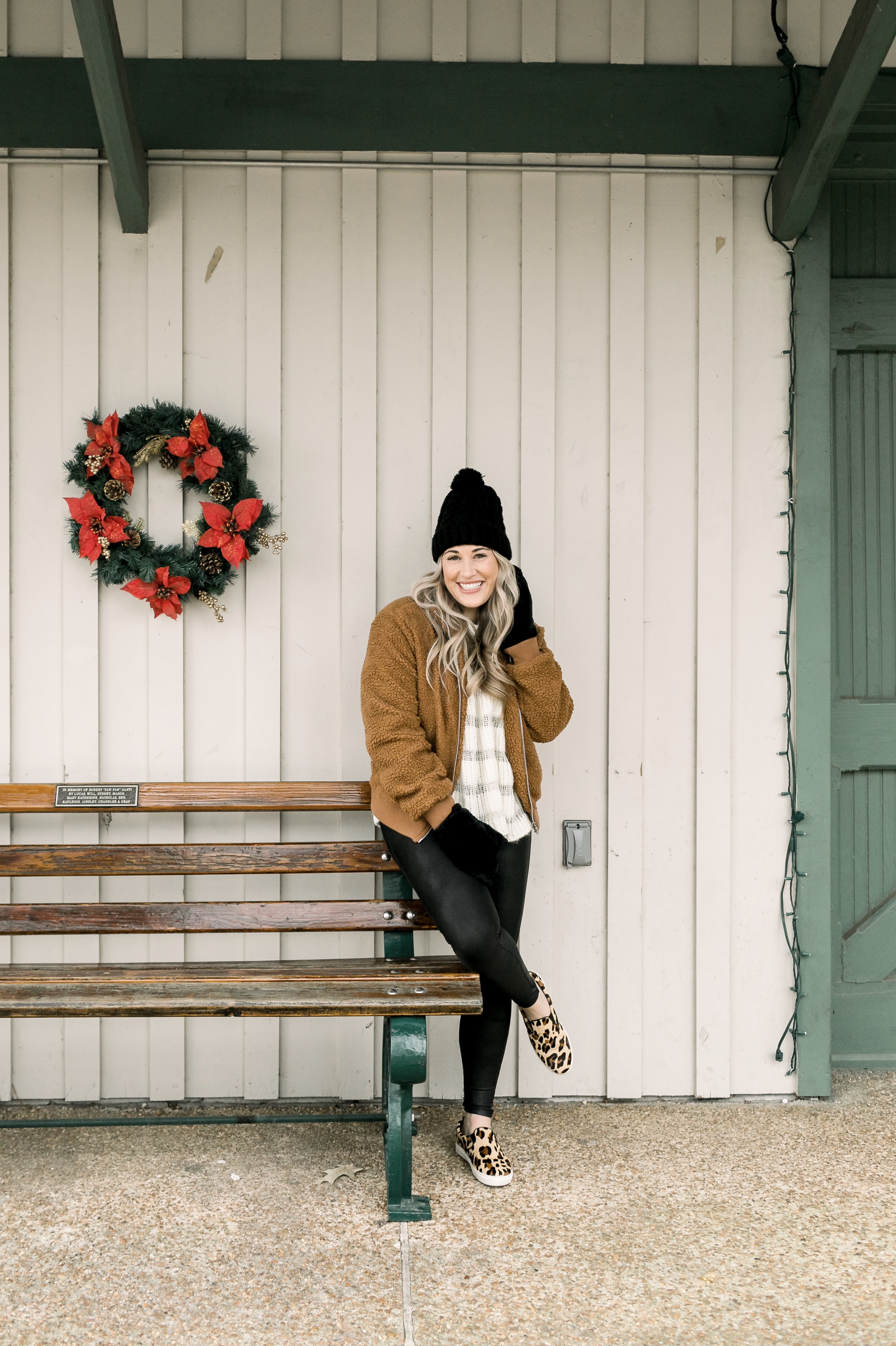 Cozy winter look styled by top US fashion blog, Walking in Memphis in High Heels: image of a woman wearing a Free People cropped sweater, New York Accessory Group pom beanie, Love + Joy teddy bear jacket, Kohl’s faux fur mittens, and Steve Madden leopard sneakers.