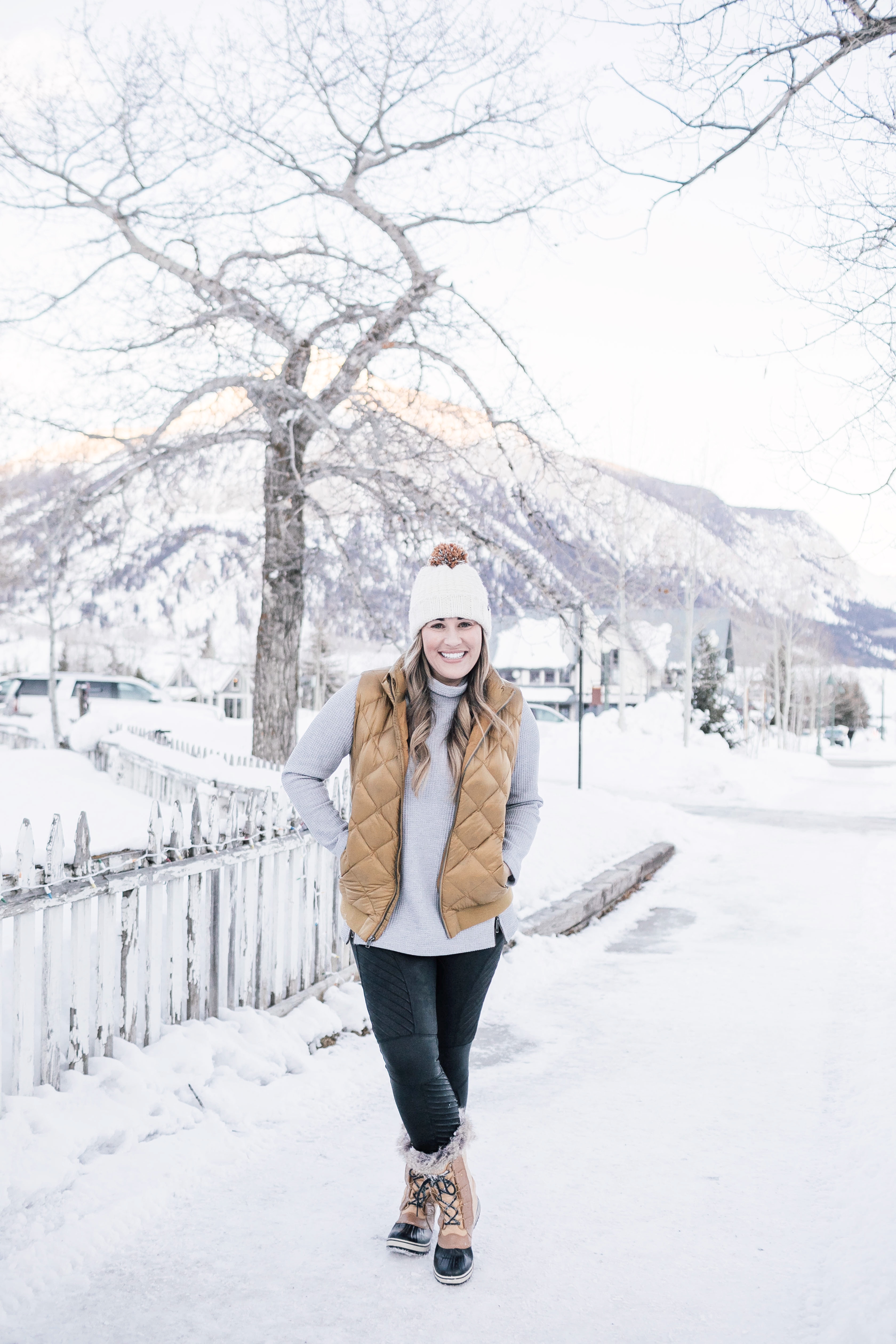 Tunic tops for leggings, styling tips featured by top Memphis fashion blog, Walking in Memphis in High Heels: image of a woman wearing SPANX faux leather motto leggings and LL Bean Mock Neck waffle tunic.
