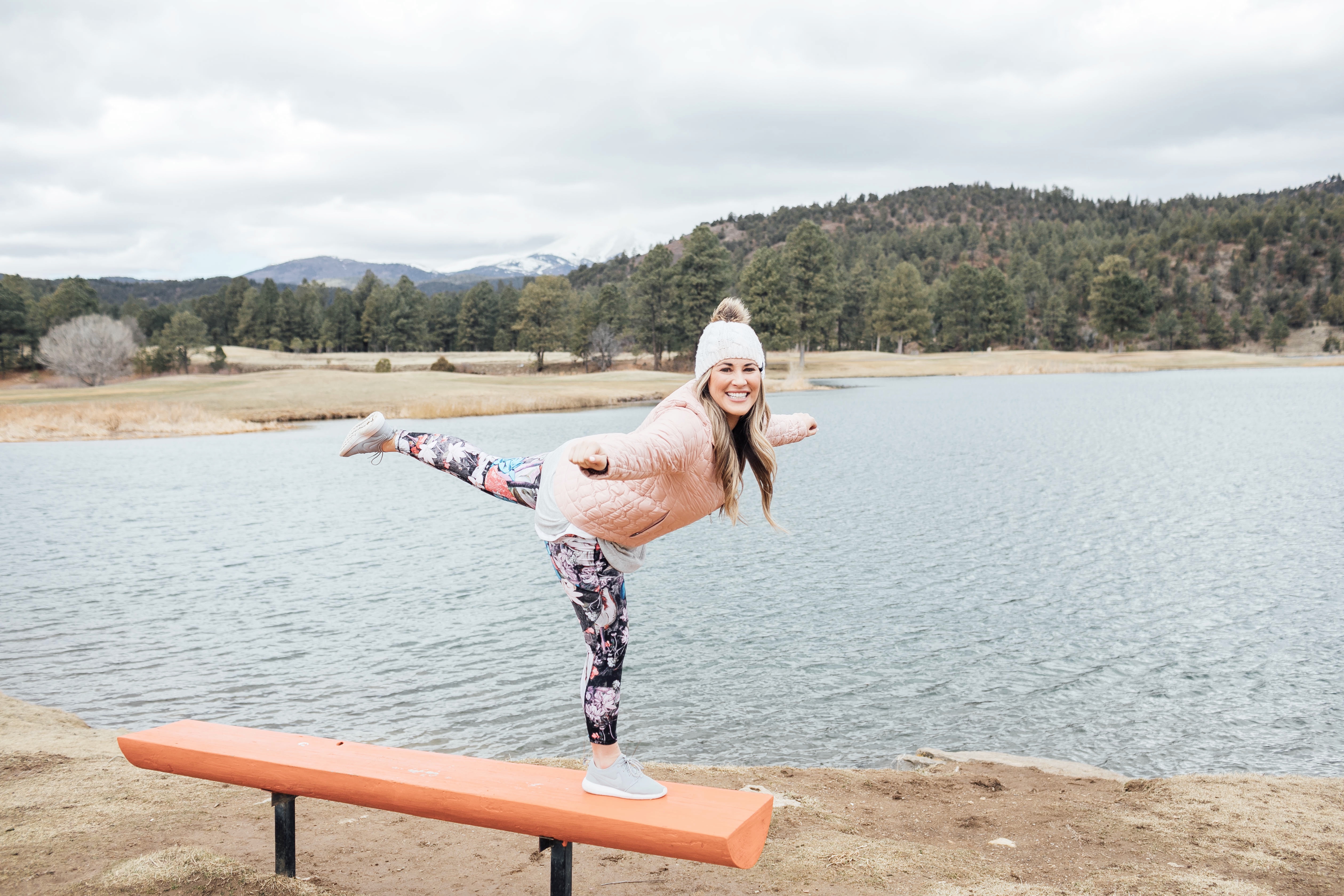 spring athleisure featured by top Memphis fashion and fitness blog, Walking in Memphis in High Heels: image of a woman Wearing CALIA by Carrie Underwood printed leggings, printed sports bra, keyhole sweater, Adidas originals run shoes