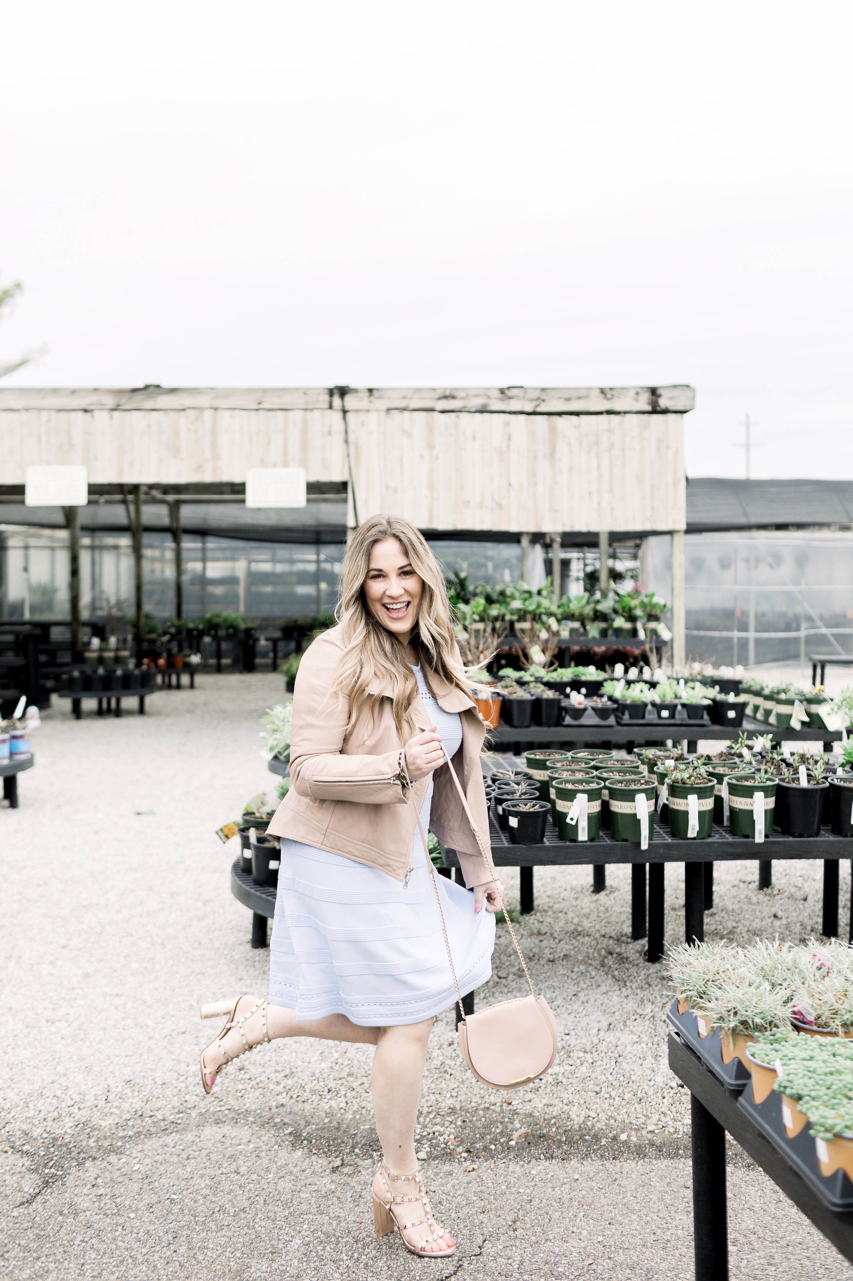 Cute Easter Dresses featured by top Memphis fashion blog, Walking in Memphis in High Heels: image of a woman wearing a pastel blue Eliza J sweater dress.