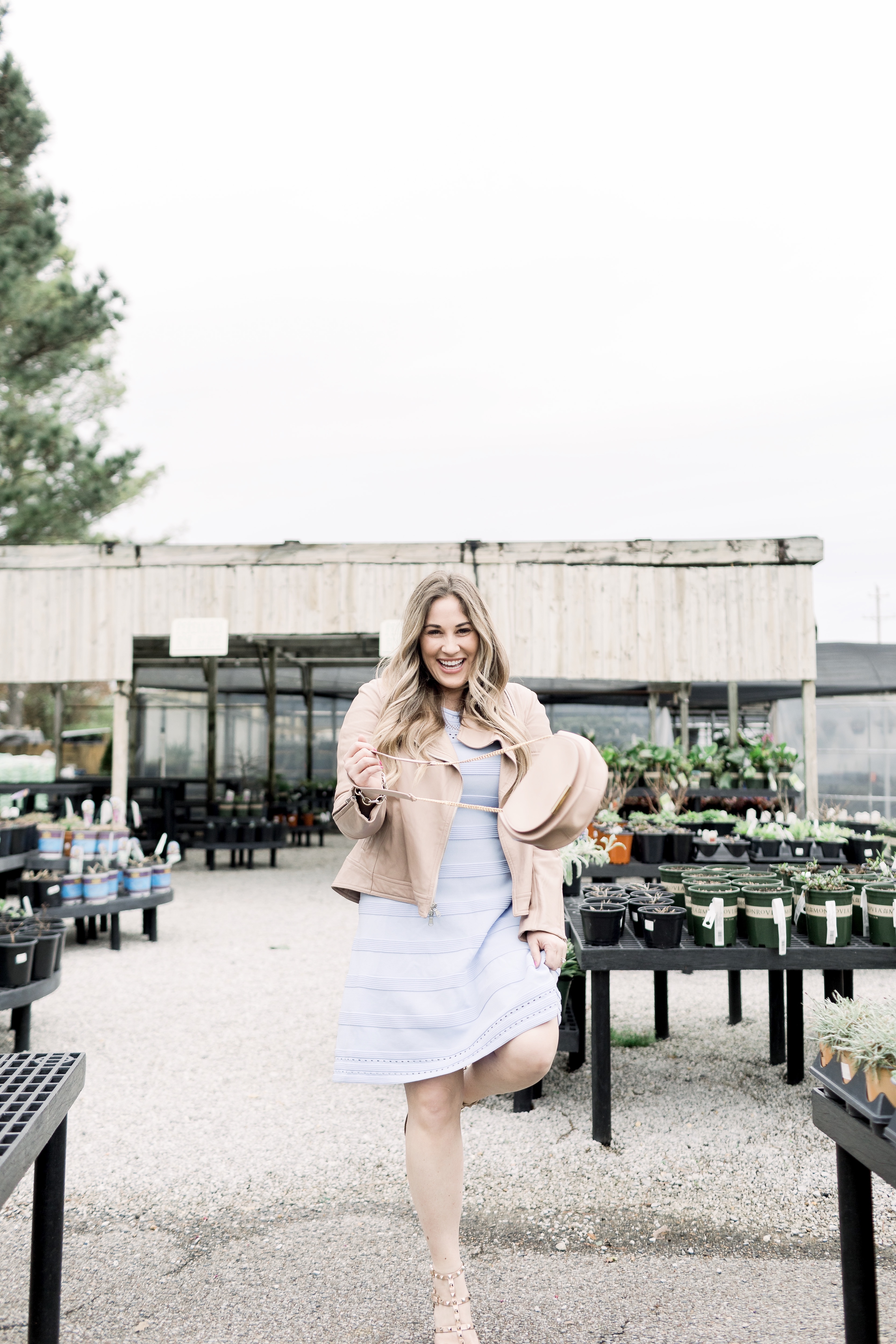 Cute Easter Dresses featured by top Memphis fashion blog, Walking in Memphis in High Heels: image of a woman wearing a pastel blue Eliza J sweater dress.