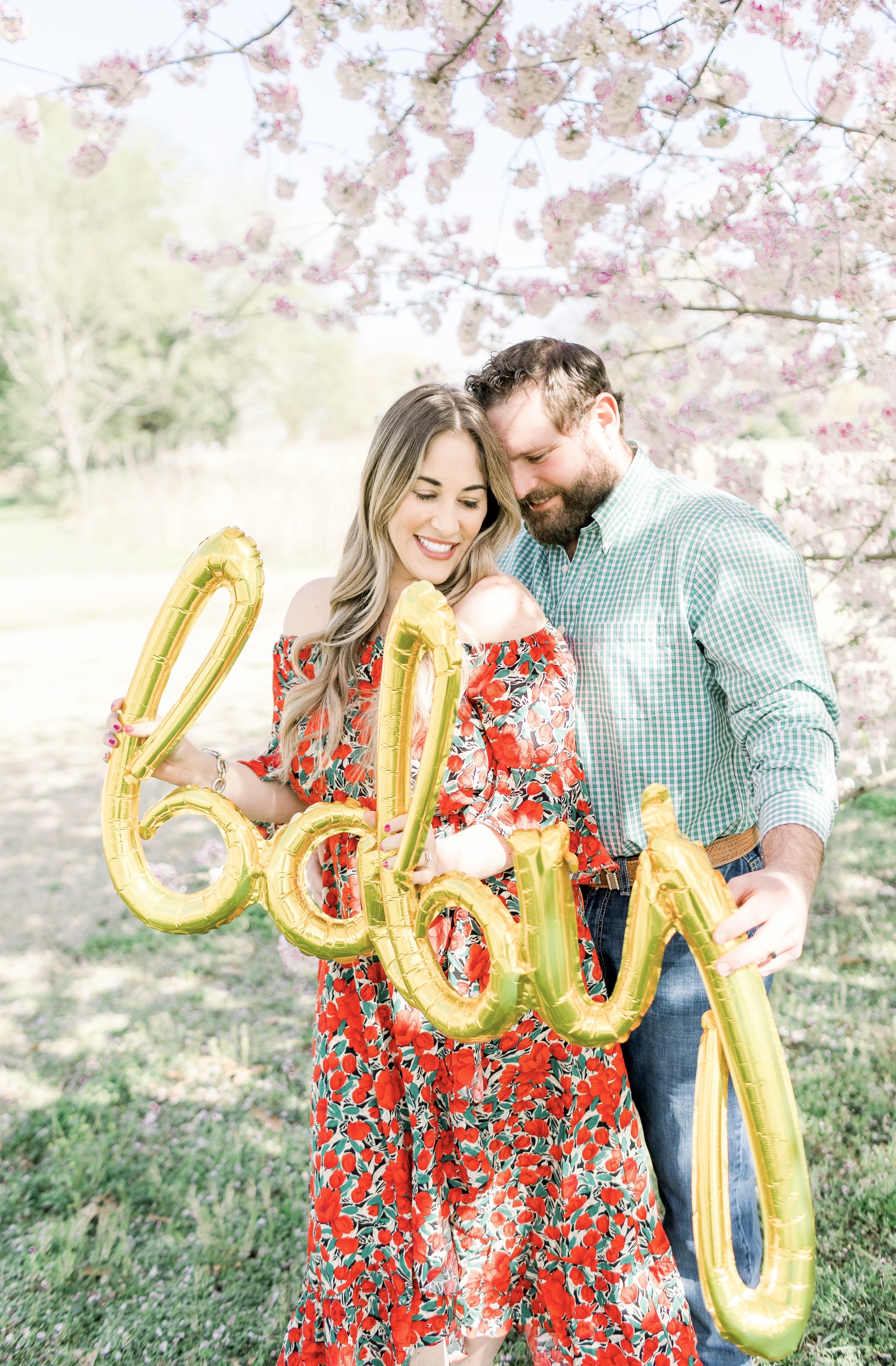 Spring florals styled by top Memphis life and style blog, Walking in Memphis in High Heels: image of a woman wearing a Pink Blush off the shoulder maxi floral dress.