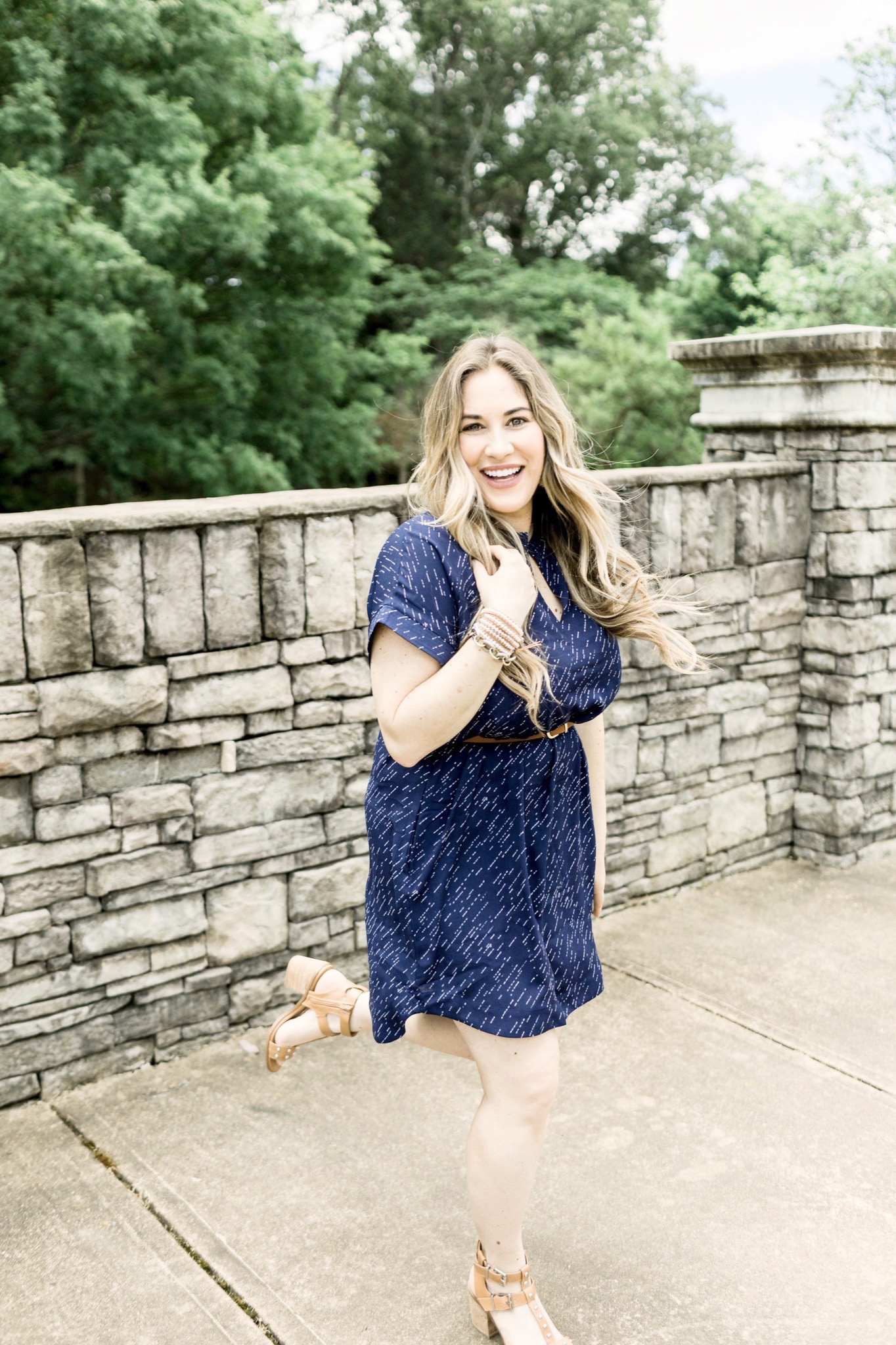 Cute Summer Dresses and Rompers featured by top Memphis fashion blog, Walking in Memphis in High Heels: image of a woman wearing a Loyal Hana polka dot maternity dress