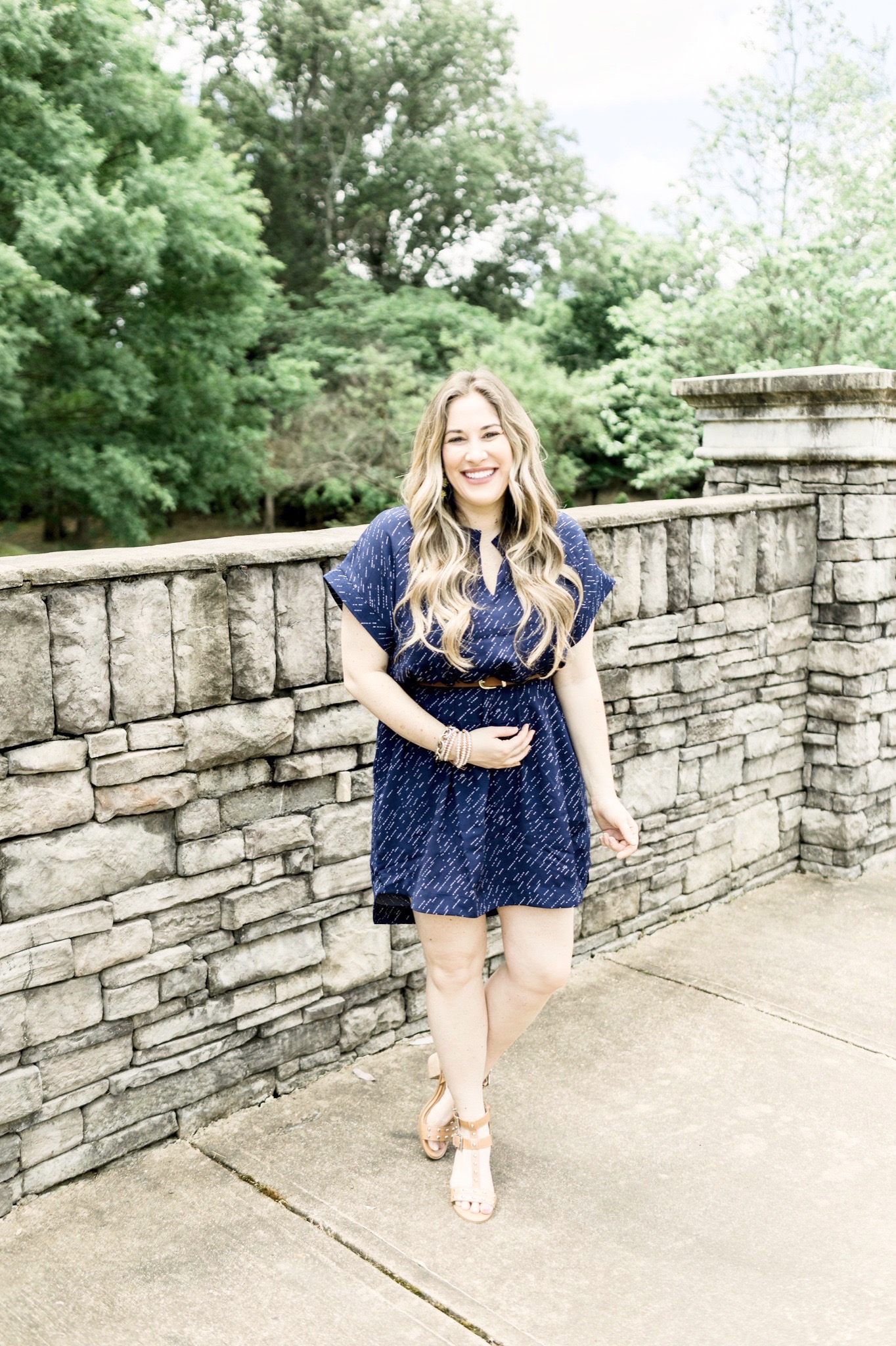 Cute Summer Dresses and Rompers featured by top Memphis fashion blog, Walking in Memphis in High Heels: image of a woman wearing a Loyal Hana polka dot maternity dress