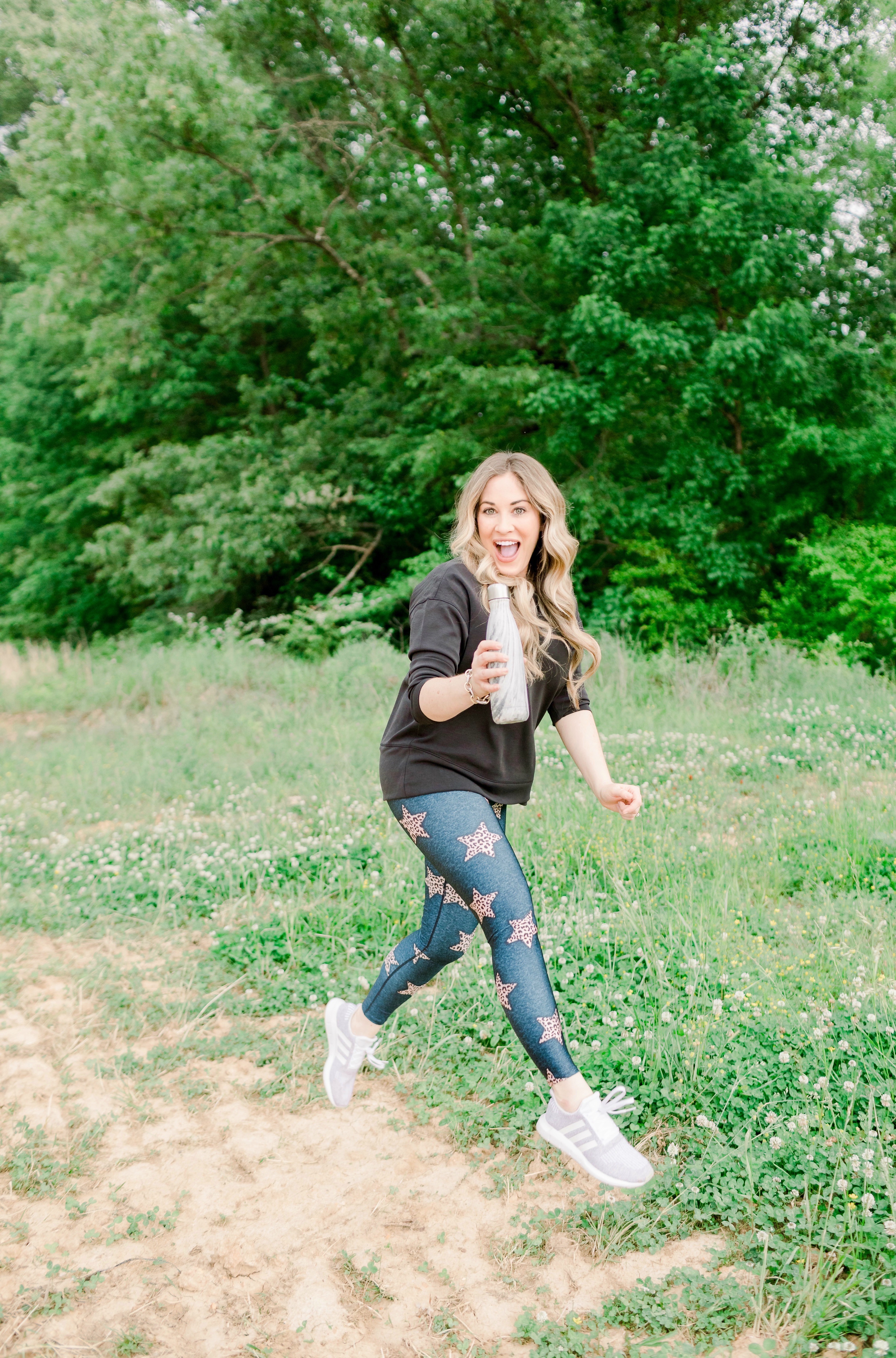 Casual spring look featured by top Memphis fashion blog, Walking in Memphis in High Heels: image of a woman wearing Adidas swift run shoes, CALIA by Carrie Underwood Sweater, and PixieLane star leggings.