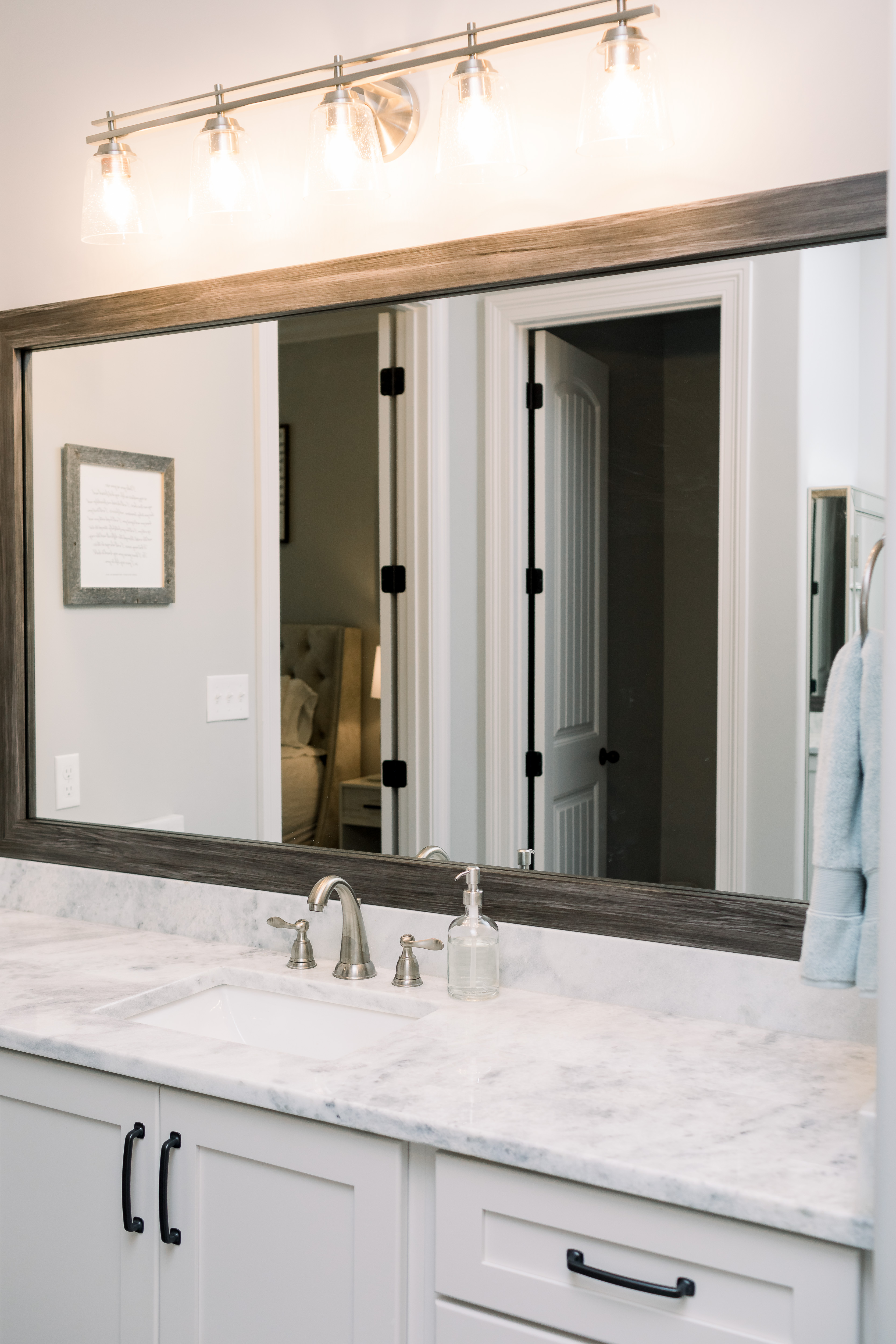 How to Update Bathroom Mirrors on a Budget, tips featured by top Memphis lifestyle blogger, Walking in Memphis in High Heels.