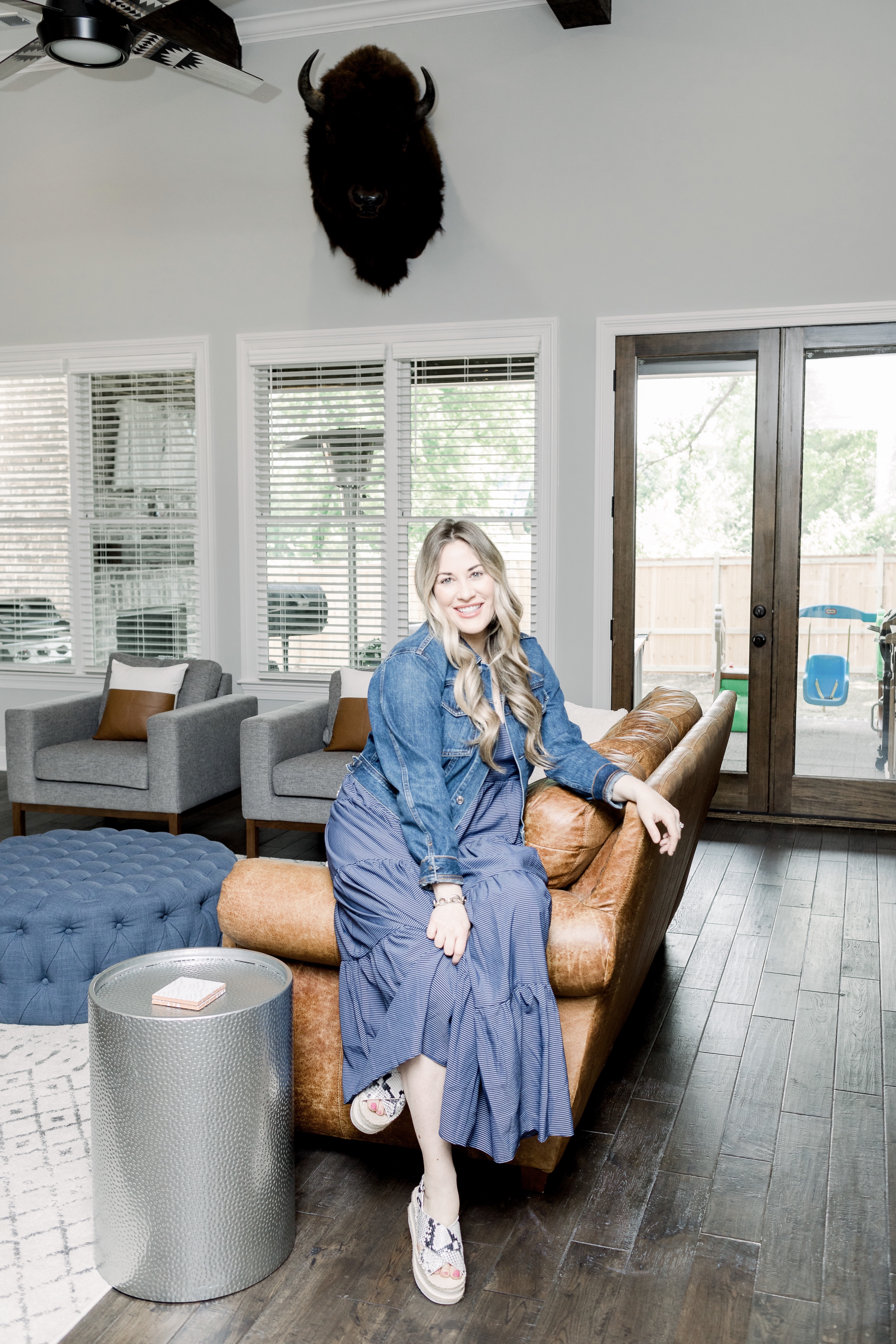 Mother's Day outfits featured by top Memphis fashion blog, Walking in Memphis in High Heels: image of a woman wearing Loyal Hana maternity dress, Everlane denim jacket and  Marc Fisher espadrille sandals.