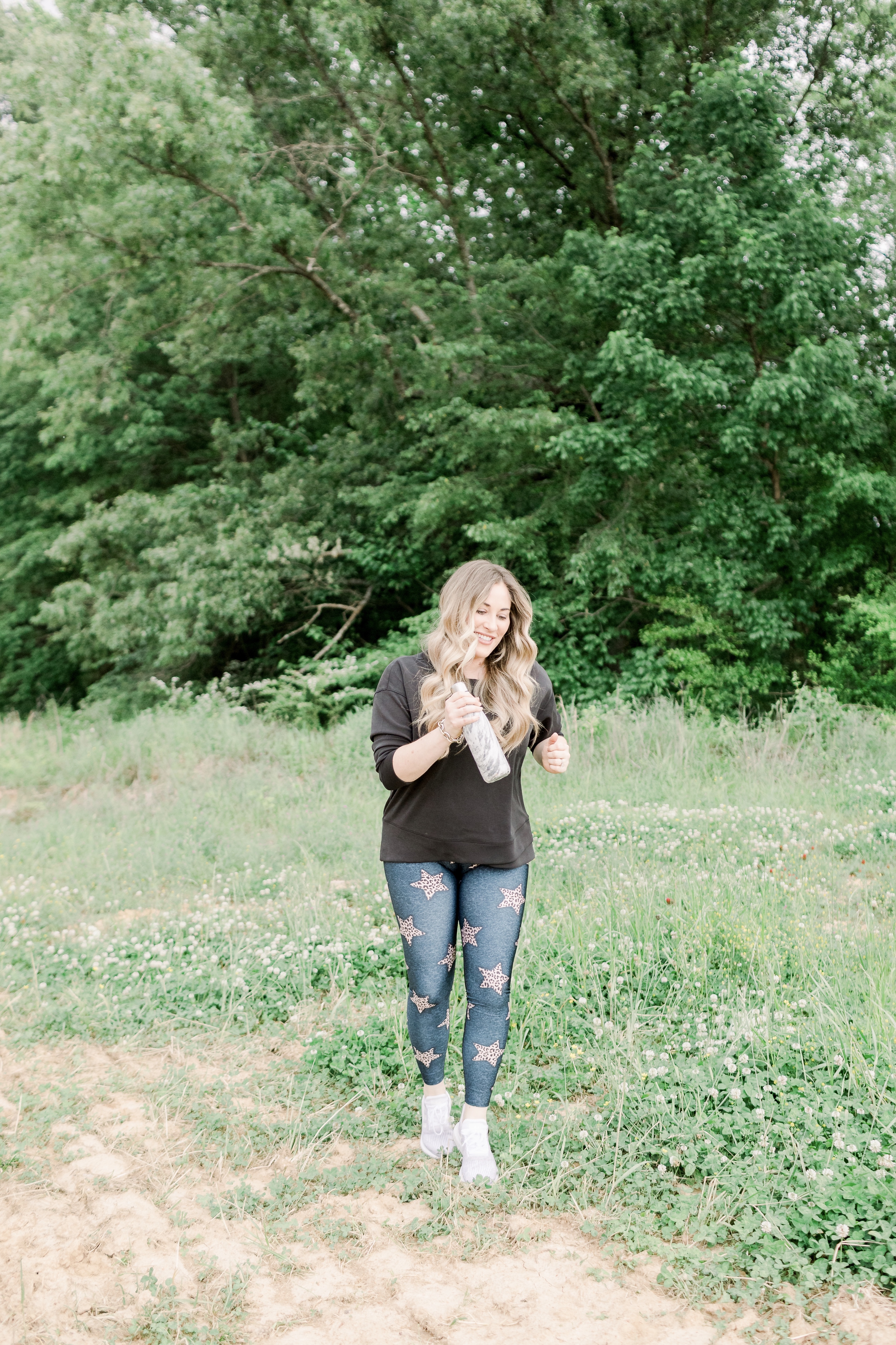 Casual spring look featured by top Memphis fashion blog, Walking in Memphis in High Heels: image of a woman wearing Adidas swift run shoes, CALIA by Carrie Underwood Sweater, and PixieLane star leggings.