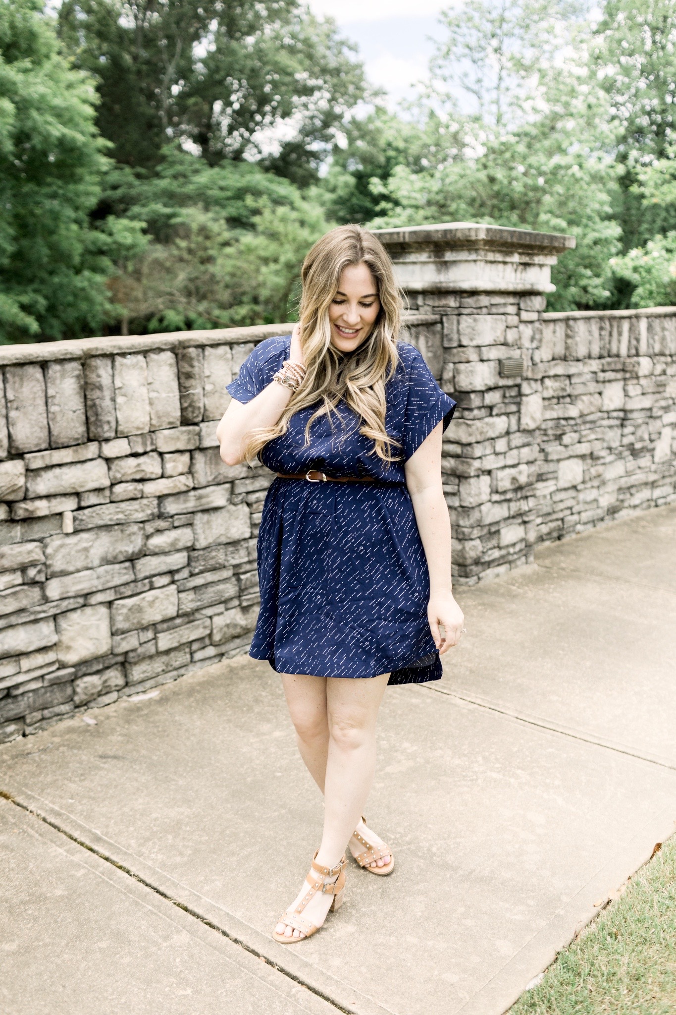 Cute Summer Dresses and Rompers featured by top Memphis fashion blog, Walking in Memphis in High Heels: image of a woman wearing a Loyal Hana polka dot maternity dress