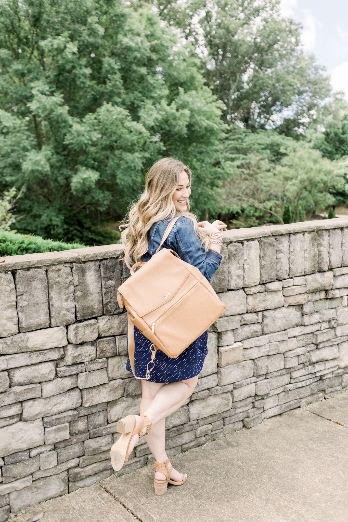 Cute Summer Dresses and Rompers featured by top Memphis fashion blog, Walking in Memphis in High Heels: image of a woman wearing a Loyal Hana polka dot maternity dress