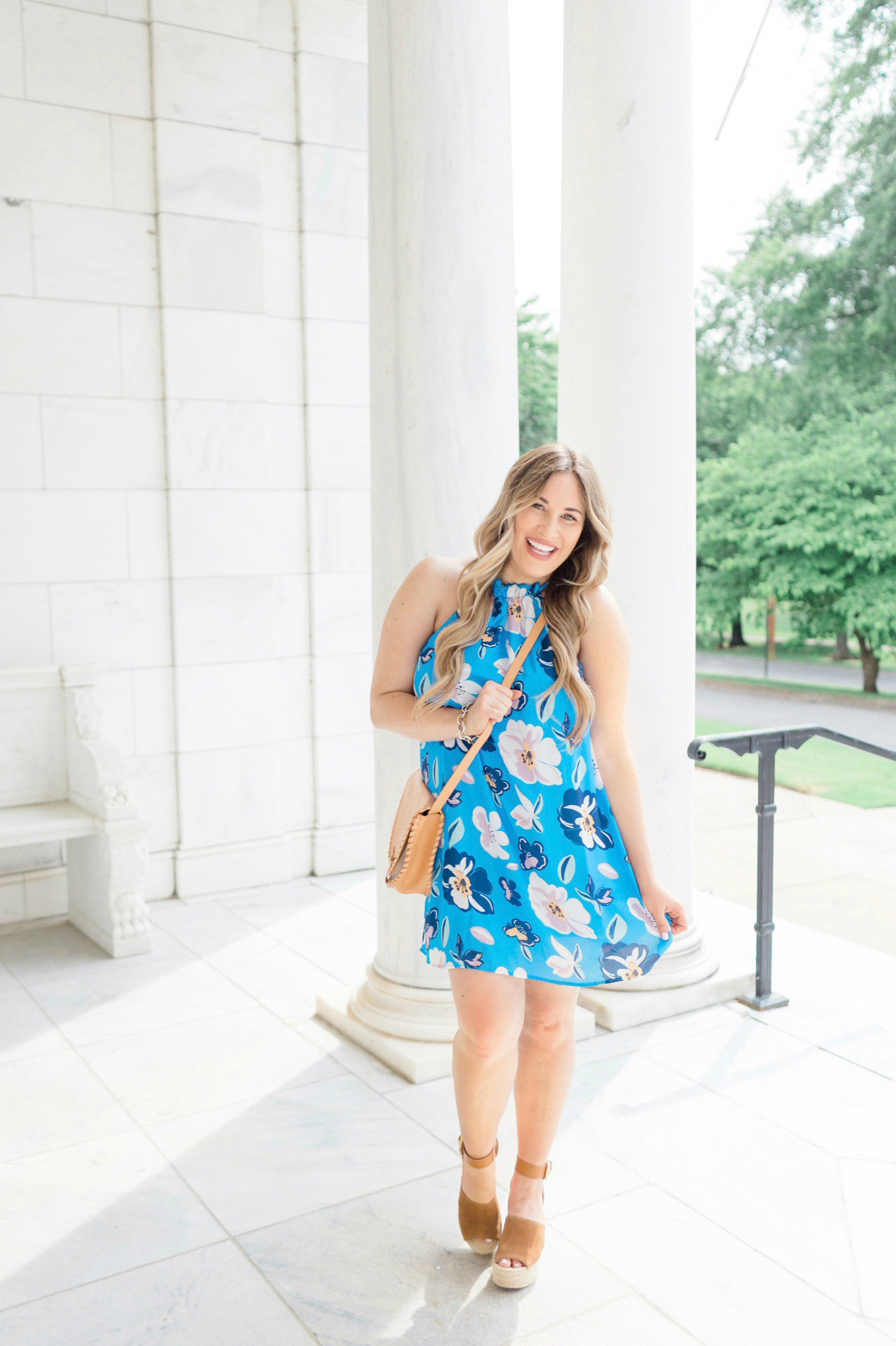 Summer colors featured by top Memphis fashion blogger, Walking in Memphis in High Heels: image of a woman wearing a Pink Lily blue floral dress.