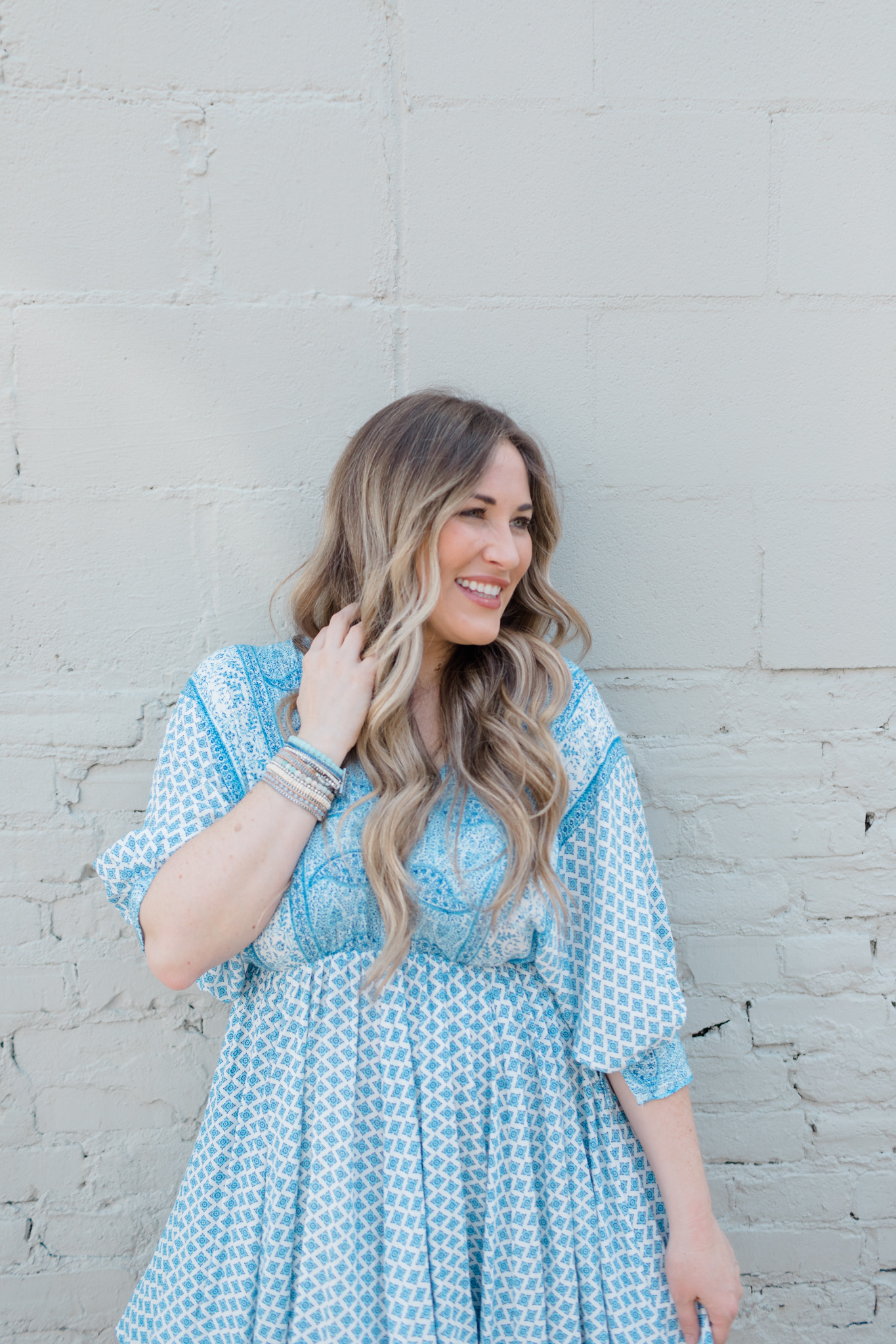 Summer accessories featured by top Memphis fashion blogger, Walking in Memphis in High Heels: image of a woman wearing Victoria Emerson bracelets.