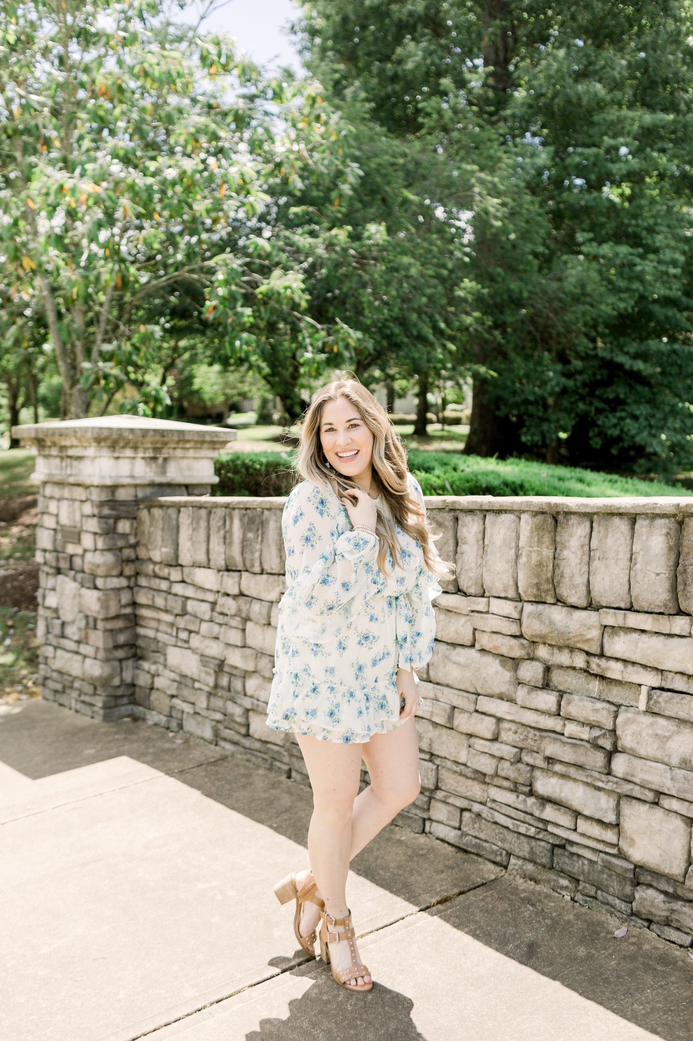 Floral romper styled for summer by top Memphis fashion blogger, Walking in Memphis in High Heels: image of a woman wearing a Red Dress Boutique Floral Romper.