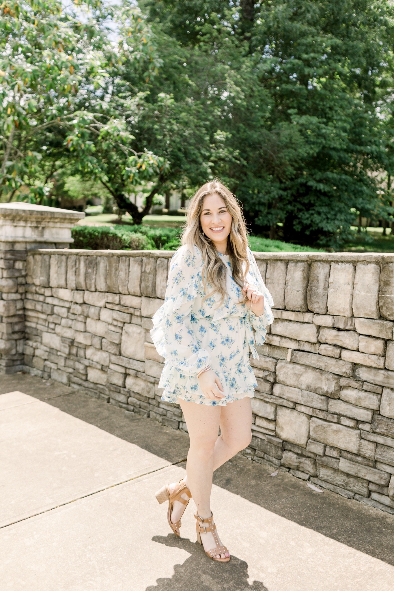 Floral romper styled for summer by top Memphis fashion blogger, Walking in Memphis in High Heels: image of a woman wearing a Red Dress Boutique Floral Romper.