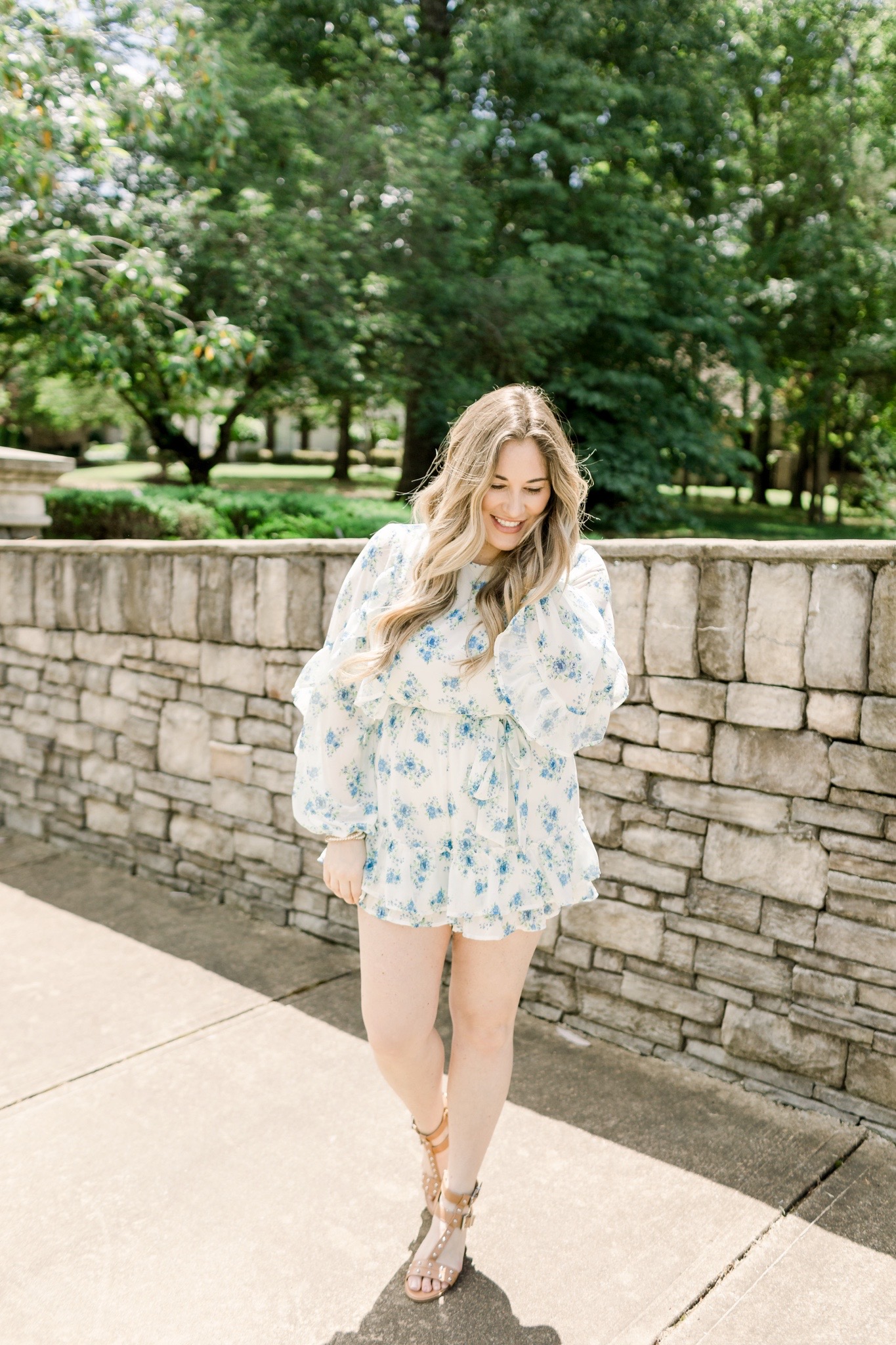 Floral romper styled for summer by top Memphis fashion blogger, Walking in Memphis in High Heels: image of a woman wearing a Red Dress Boutique Floral Romper.