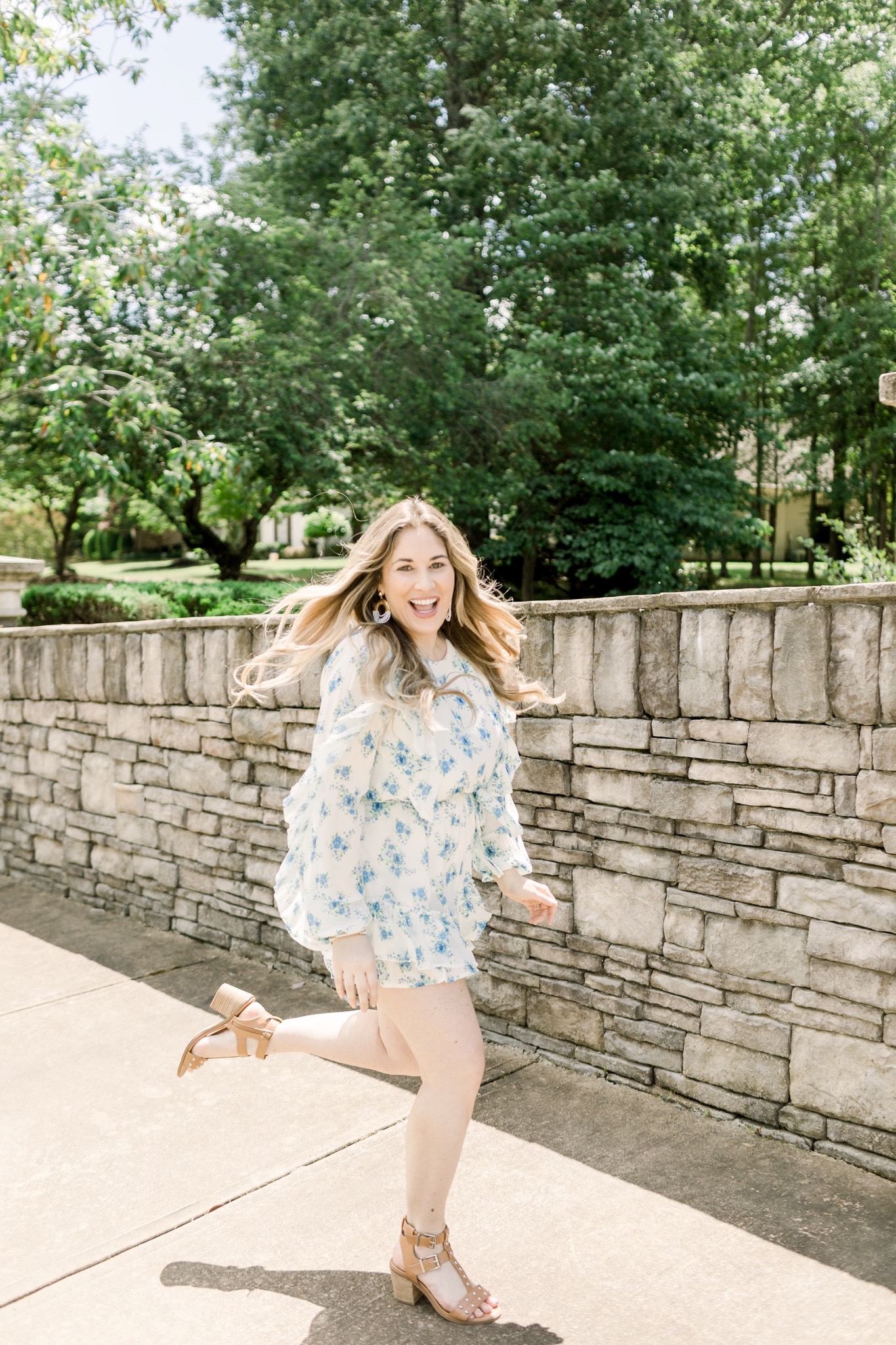 Floral romper styled for summer by top Memphis fashion blogger, Walking in Memphis in High Heels: image of a woman wearing a Red Dress Boutique Floral Romper.