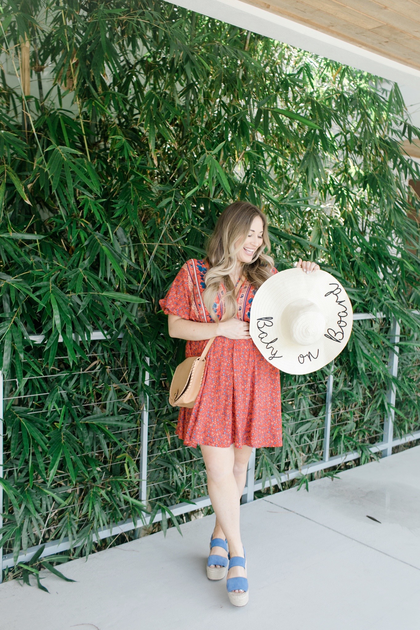 Labor Day looks featured by top Memphis fashion blogger, Walking in Memphis in High Heels: image of a woman wearing a Red Dress Boutique dress, Marc Fisher blue espadrille wedges, and a Pink Lily floppy hat.