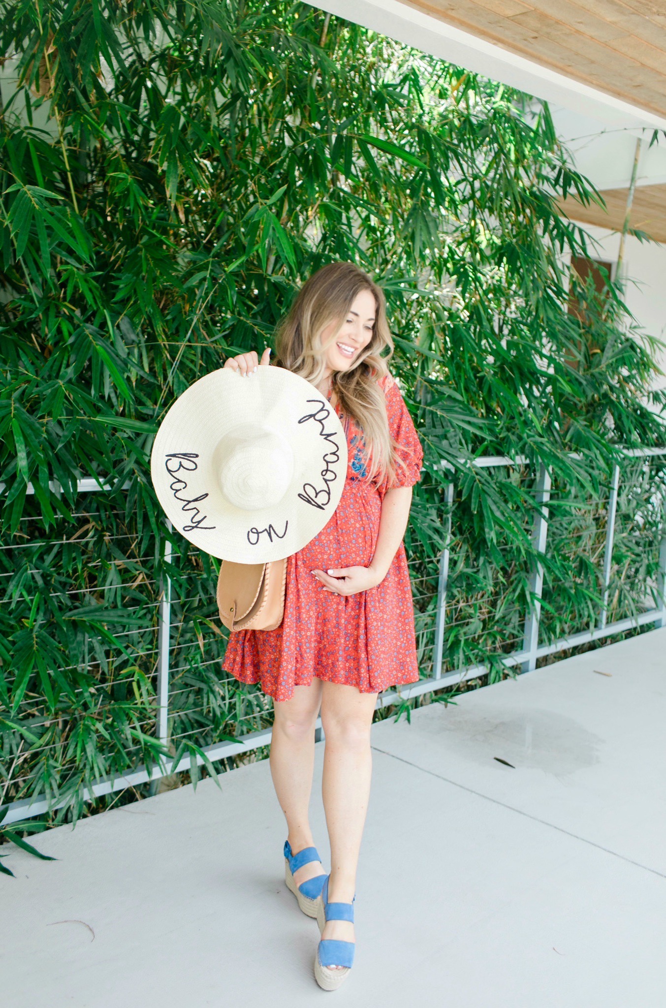 Labor Day looks featured by top Memphis fashion blogger, Walking in Memphis in High Heels: image of a woman wearing a Red Dress Boutique dress, Marc Fisher blue espadrille wedges, and a Pink Lily floppy hat.