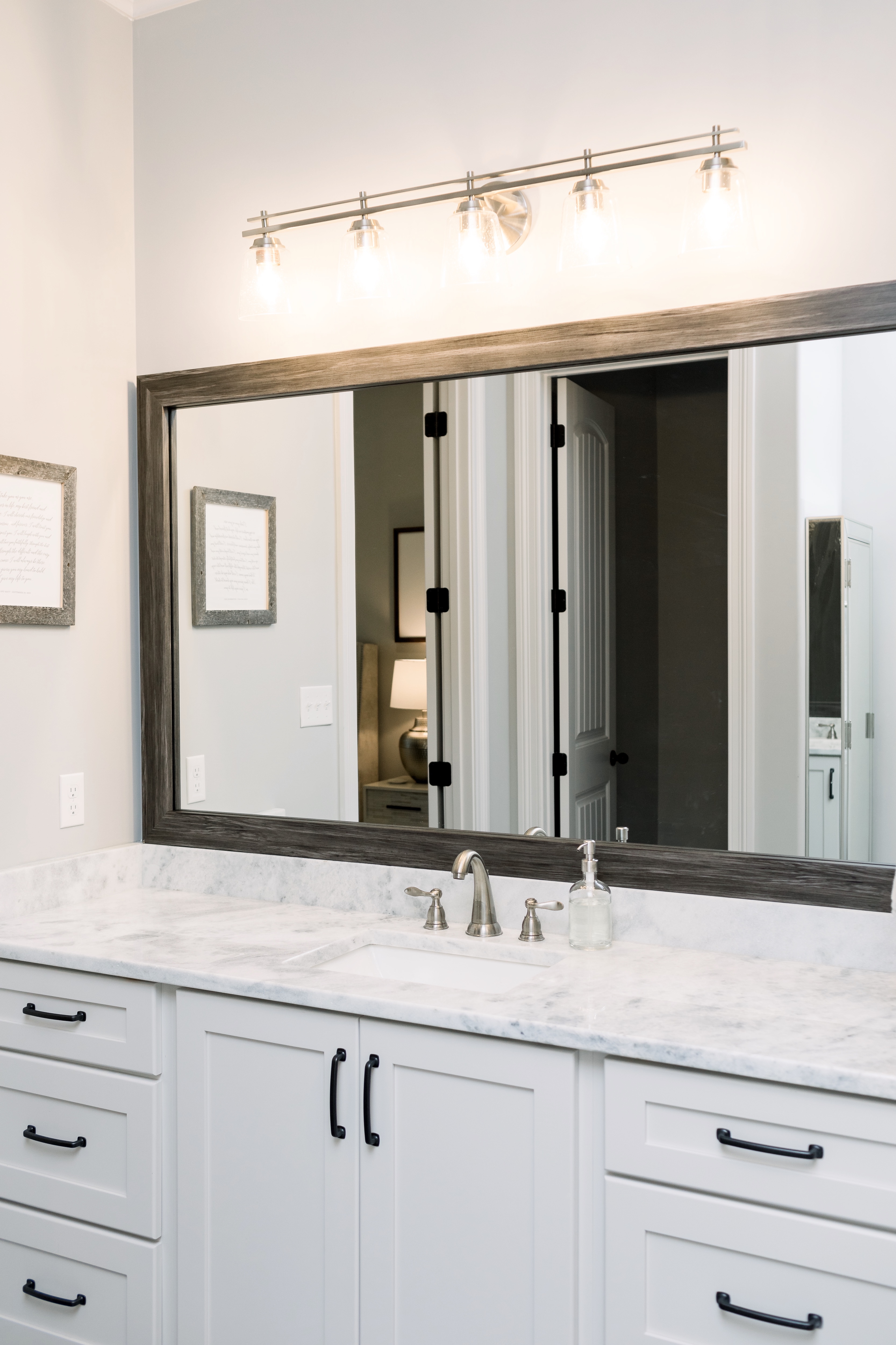 How to Update Bathroom Mirrors on a Budget, tips featured by top Memphis lifestyle blogger, Walking in Memphis in High Heels.