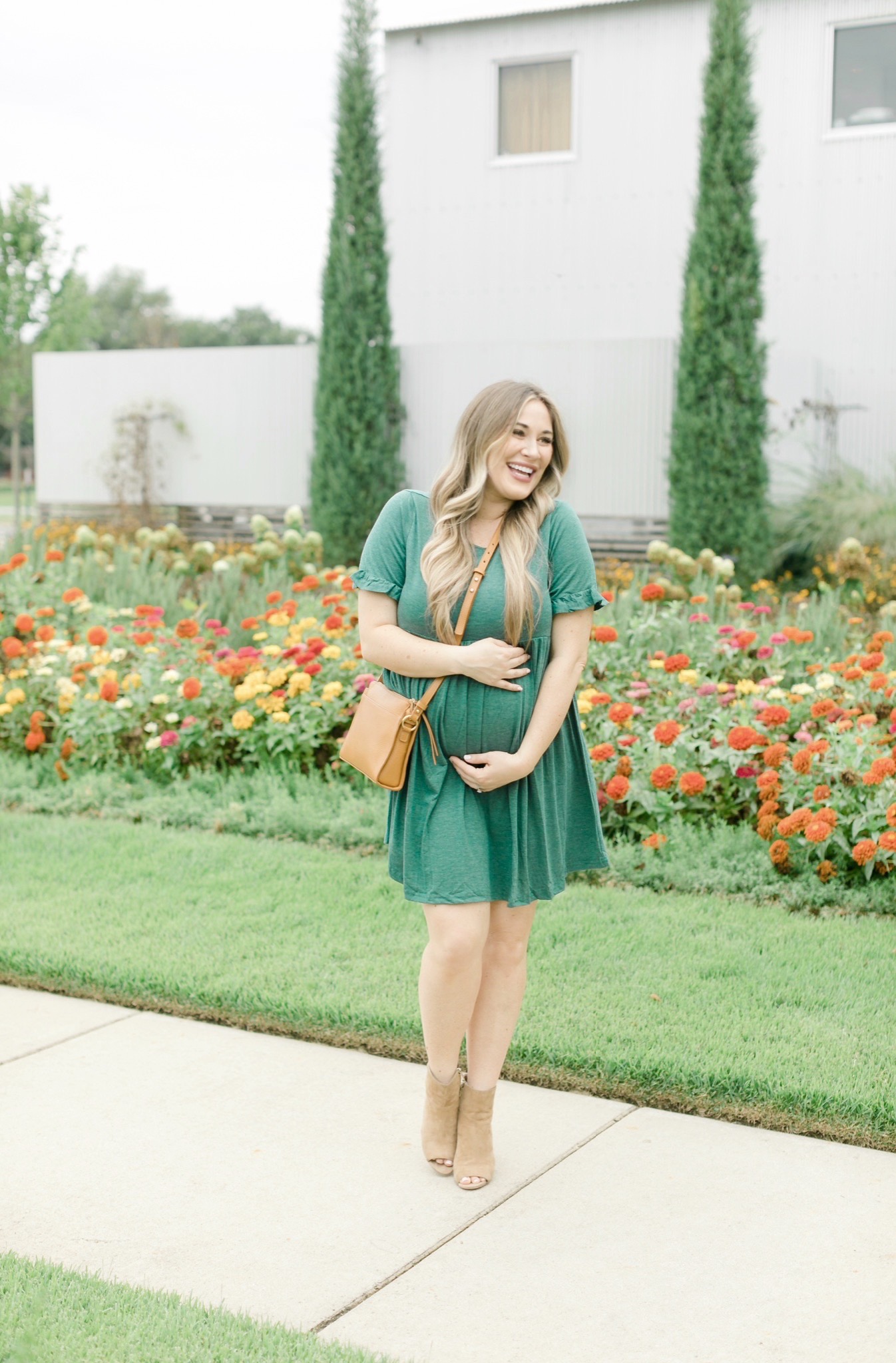 Fall style featured by top Memphis fashion blogger, Walking in Memphis in High Heels: image of a women wearing a Romwe maternity dress, Vince Camuto booties, and Gigi newYork Whitney Crossbody.