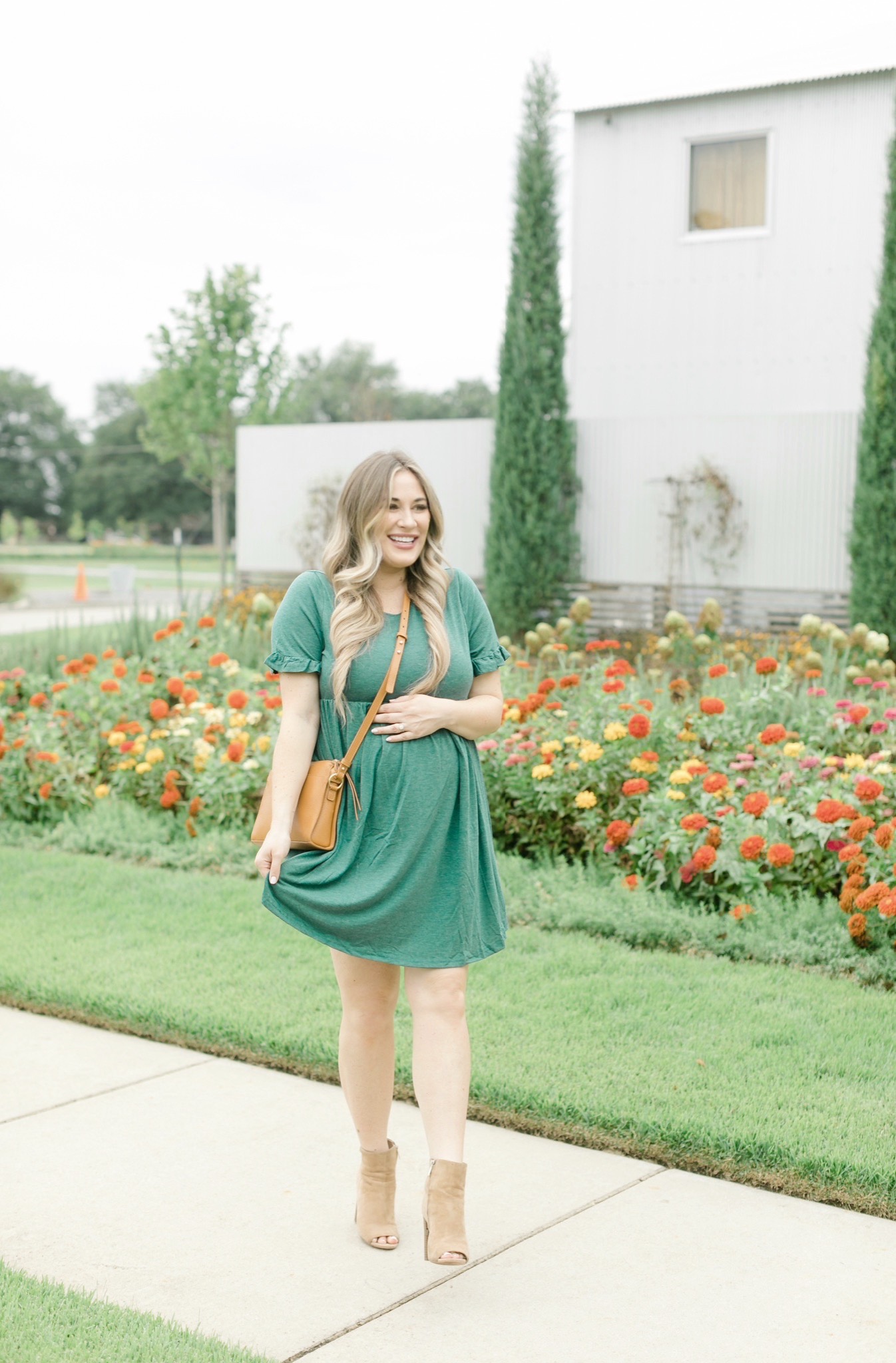 Fall style featured by top Memphis fashion blogger, Walking in Memphis in High Heels: image of a women wearing a Romwe maternity dress, Vince Camuto booties, and Gigi newYork Whitney Crossbody.