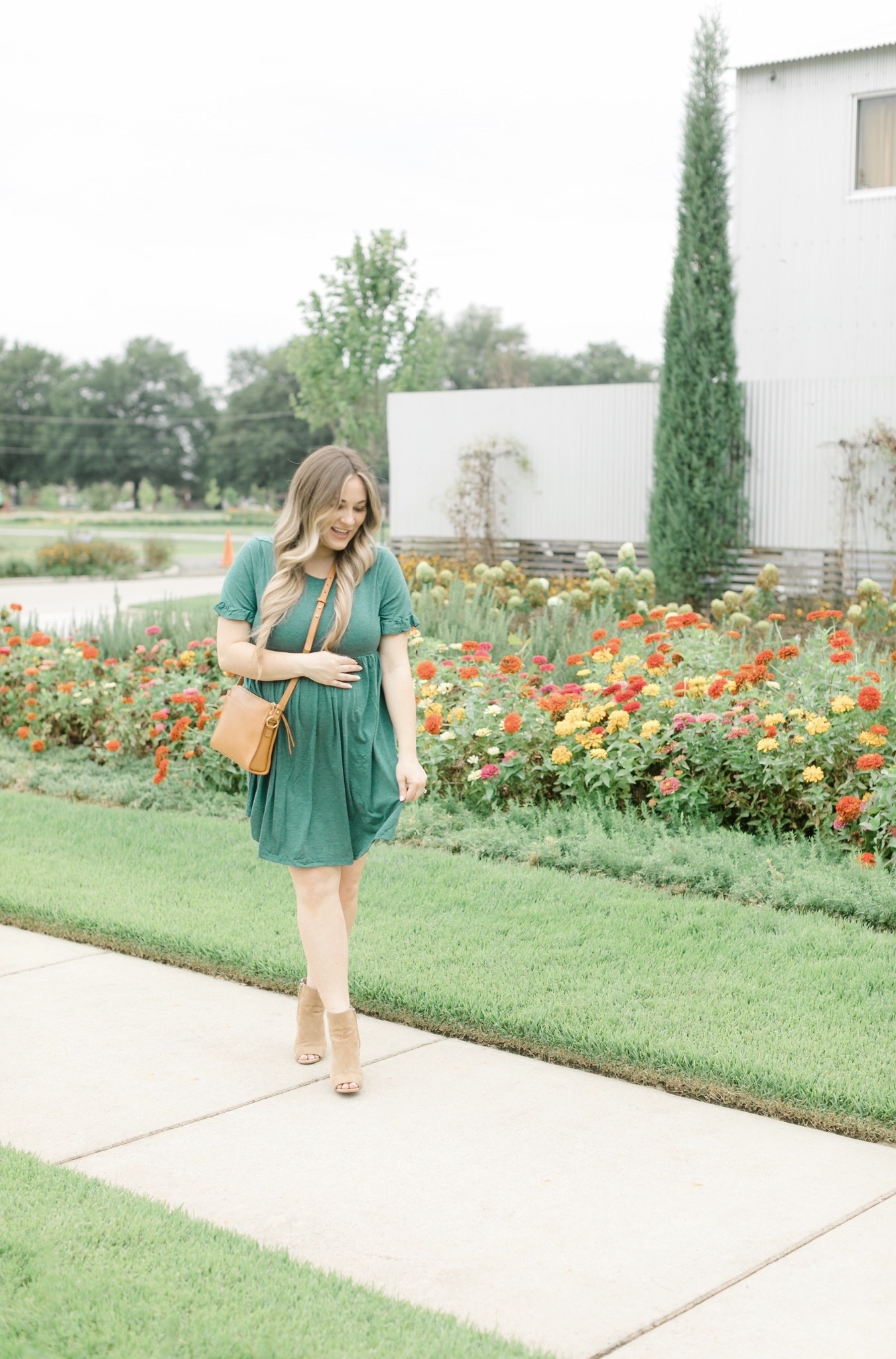 Fall style featured by top Memphis fashion blogger, Walking in Memphis in High Heels: image of a women wearing a Romwe maternity dress, Vince Camuto booties, and Gigi newYork Whitney Crossbody.