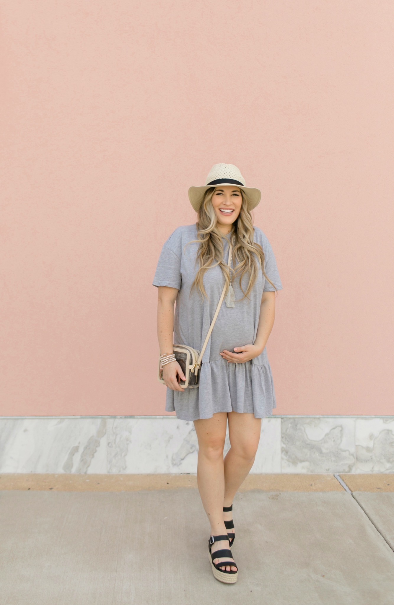 Casual maternity look feature dby top Memphis fashion blogger, Walking in Memphis in High Heels: image of a pregnant woman wearing a Nasty Gal striped tee shirt mini dress, Valett strap sandals, and a Gigi NewYork Collins Crossbody
