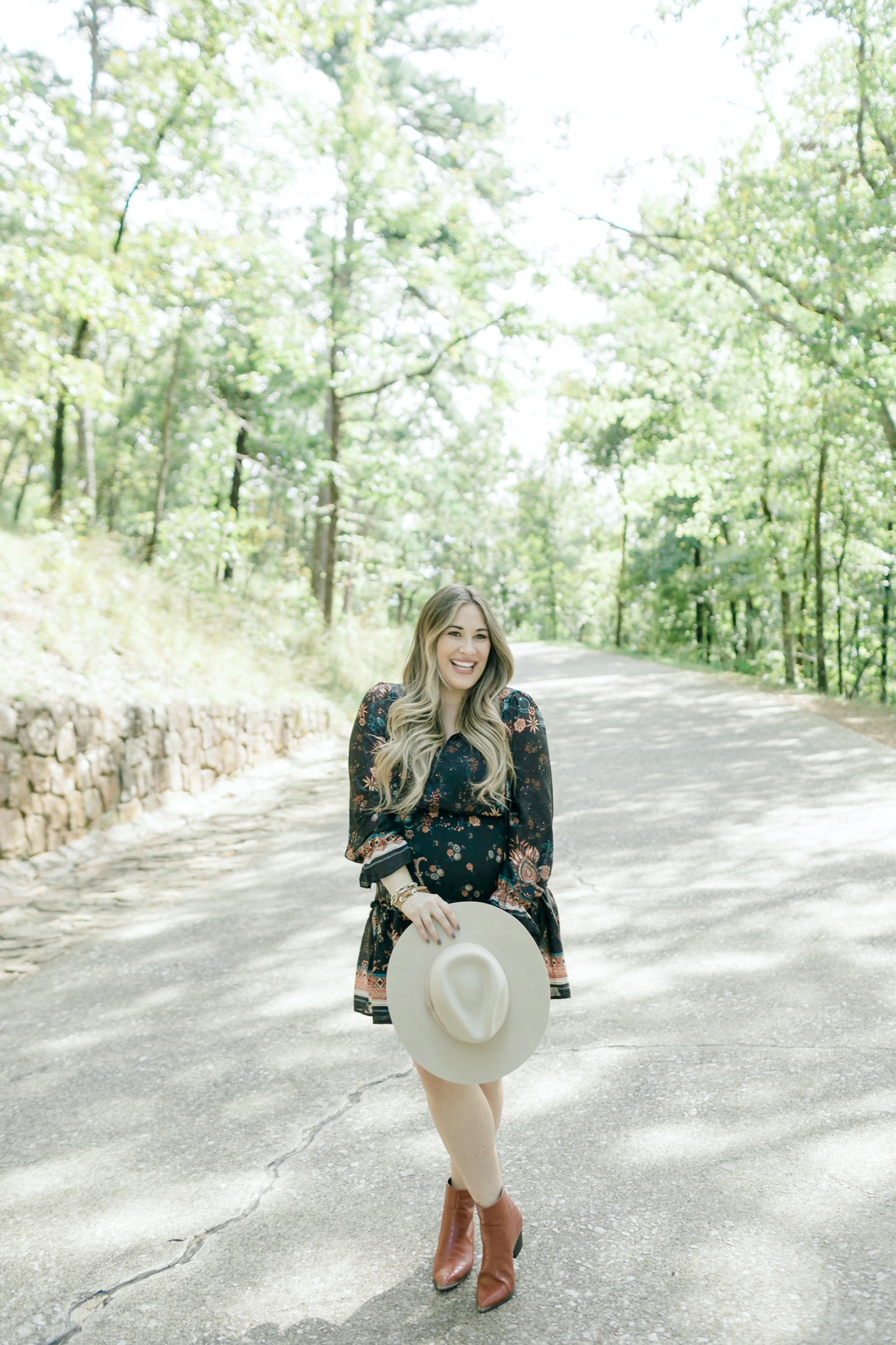 Cute Thanksgiving looks featured by top Memphis fashion blogger, Walking in Memphis in High Heels> image of a pregnant woman wearing a Red Dress floral dress, a Red Dress panama hat, Red Dress brown booties.