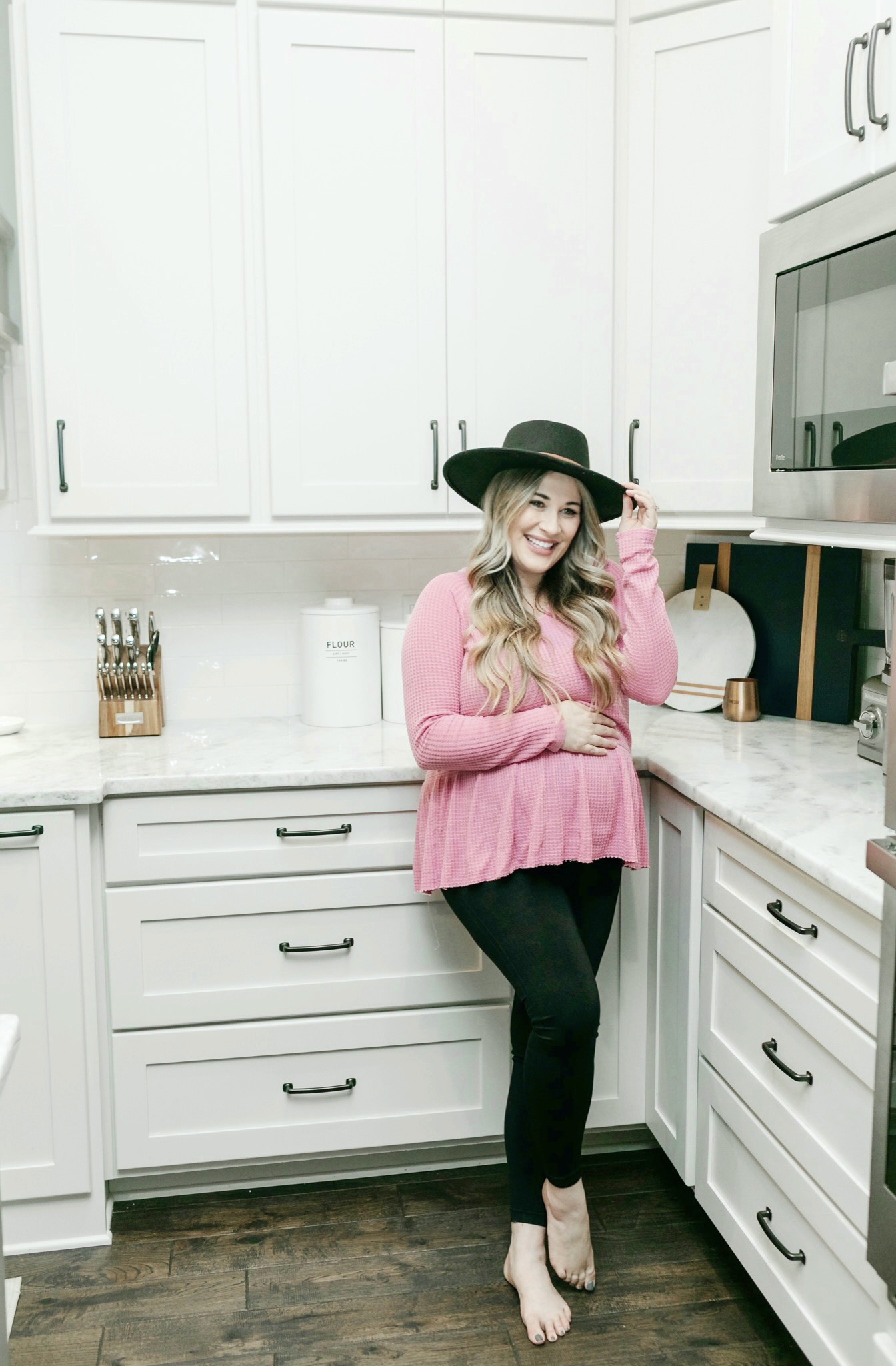 Fall casual outfits featured by top Memphis fashion blogger, Walking in Memphis in High Heels: image of a woman wearing BLANQI postpartum leggings, Time and Tru peplum top, and Gigi Pip fedora hat.
