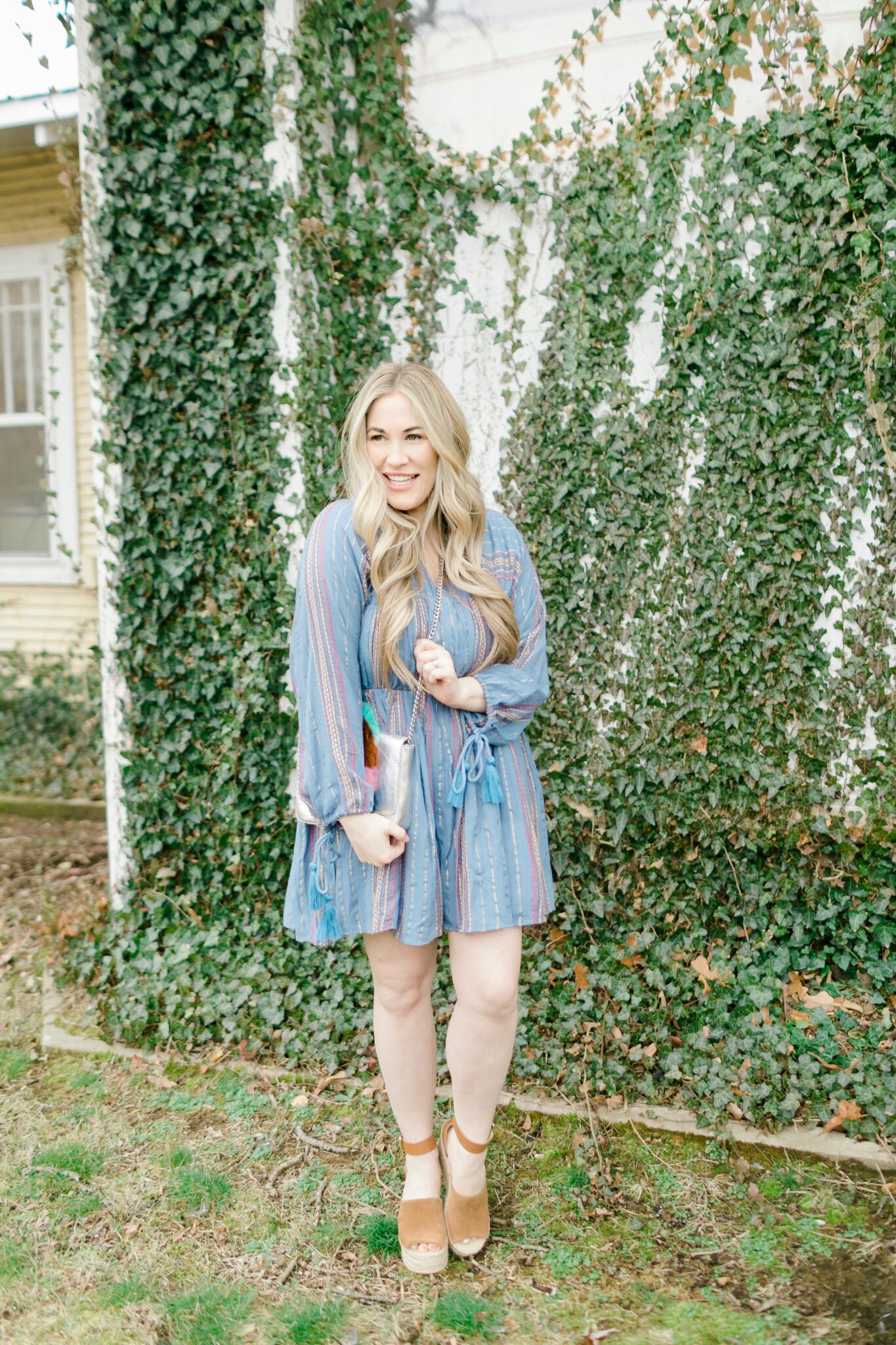 Cute spring dresses featured by top Memphis fashion blogger, Walking in Memphis in High Heels: image of a woman wearing an ASOS denim striped dress