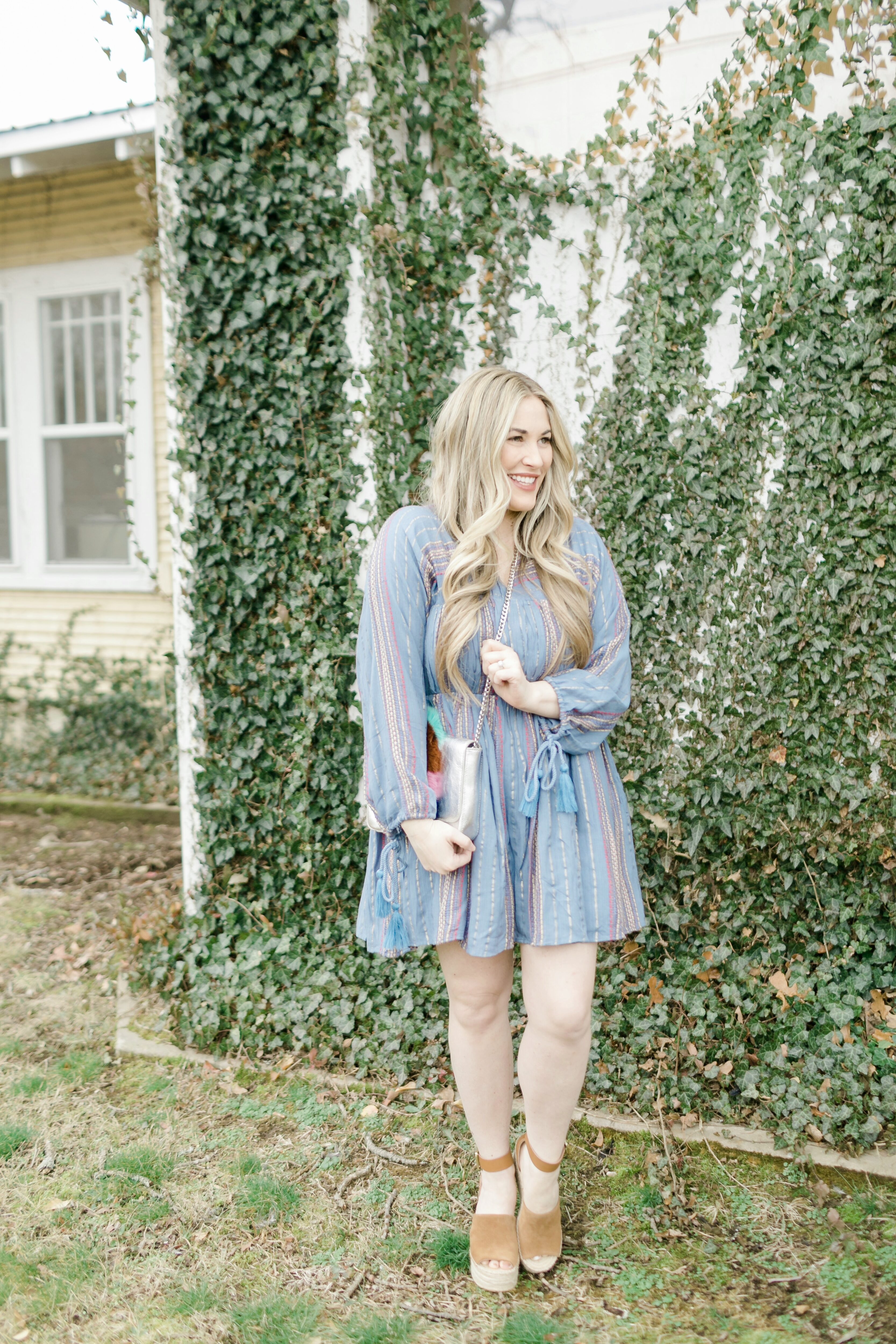 Cute spring dresses featured by top Memphis fashion blogger, Walking in Memphis in High Heels: image of a woman wearing an ASOS denim striped dress