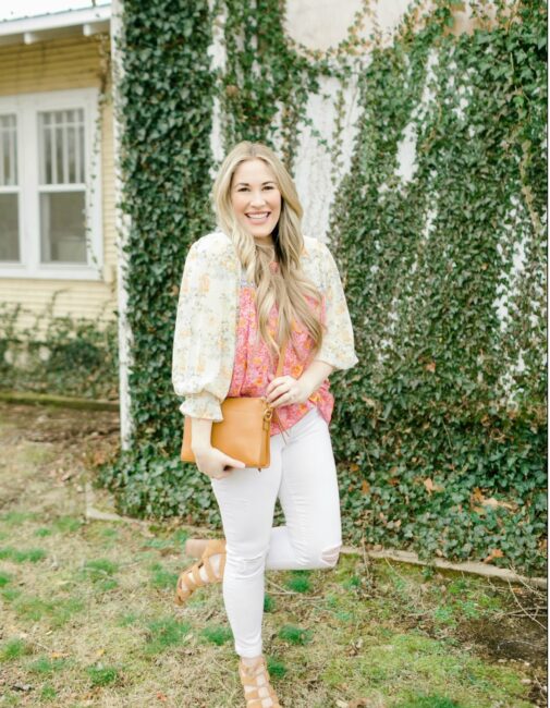 Cute Spring Outfit styled by top Memphis fashion blogger, Walking in Memphis in High Heels: image of a woman wearing a Red Dress Boutique floral top, Express high waisted skinny white jeans, and Gigi New York crossbody bag.