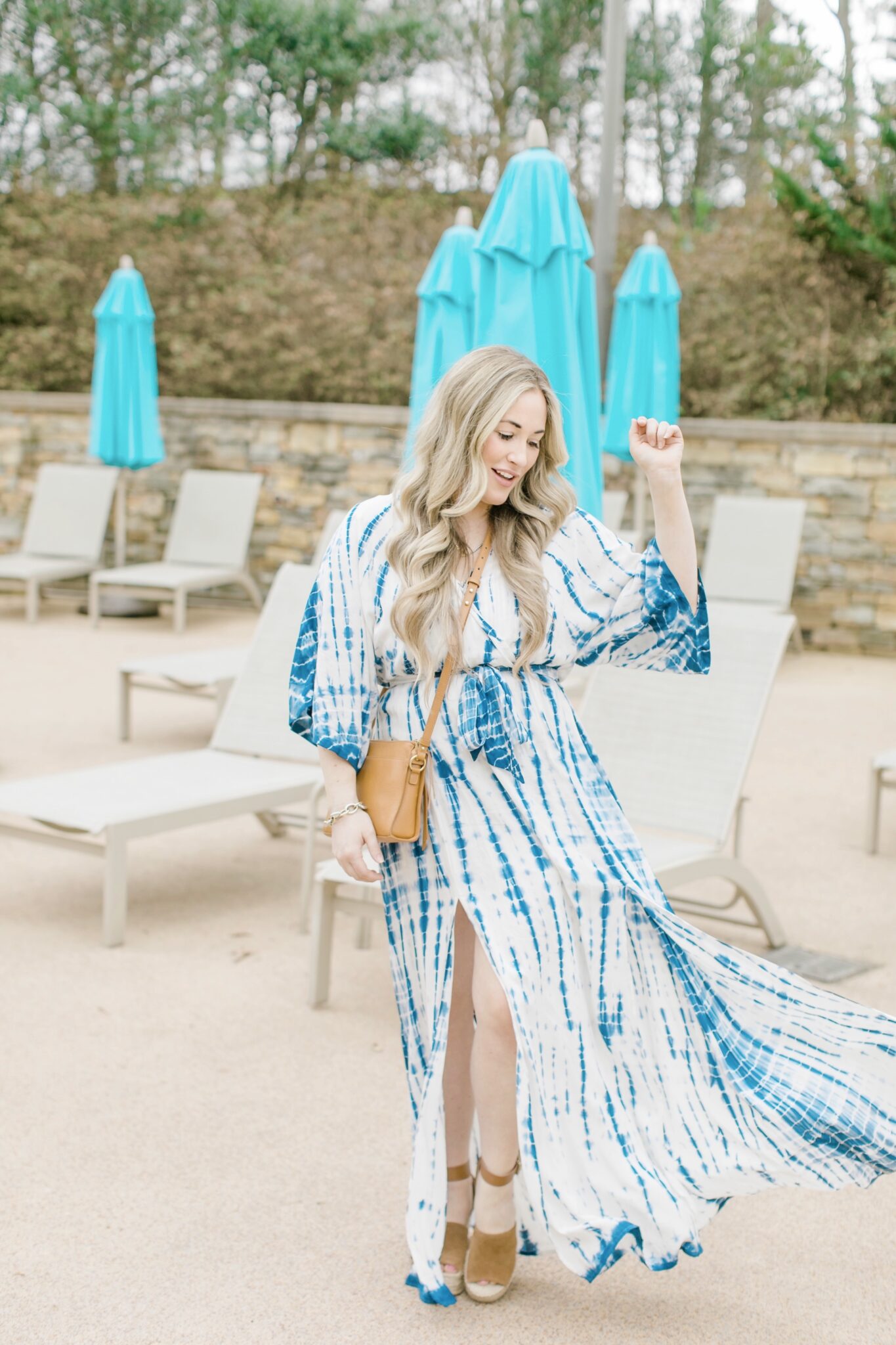 Cute spring sandals featured by top Memphis fashion blogger, Walking in Memphis in High Heels: image of a woman wearing Marc Fisher wedge espadrilles.