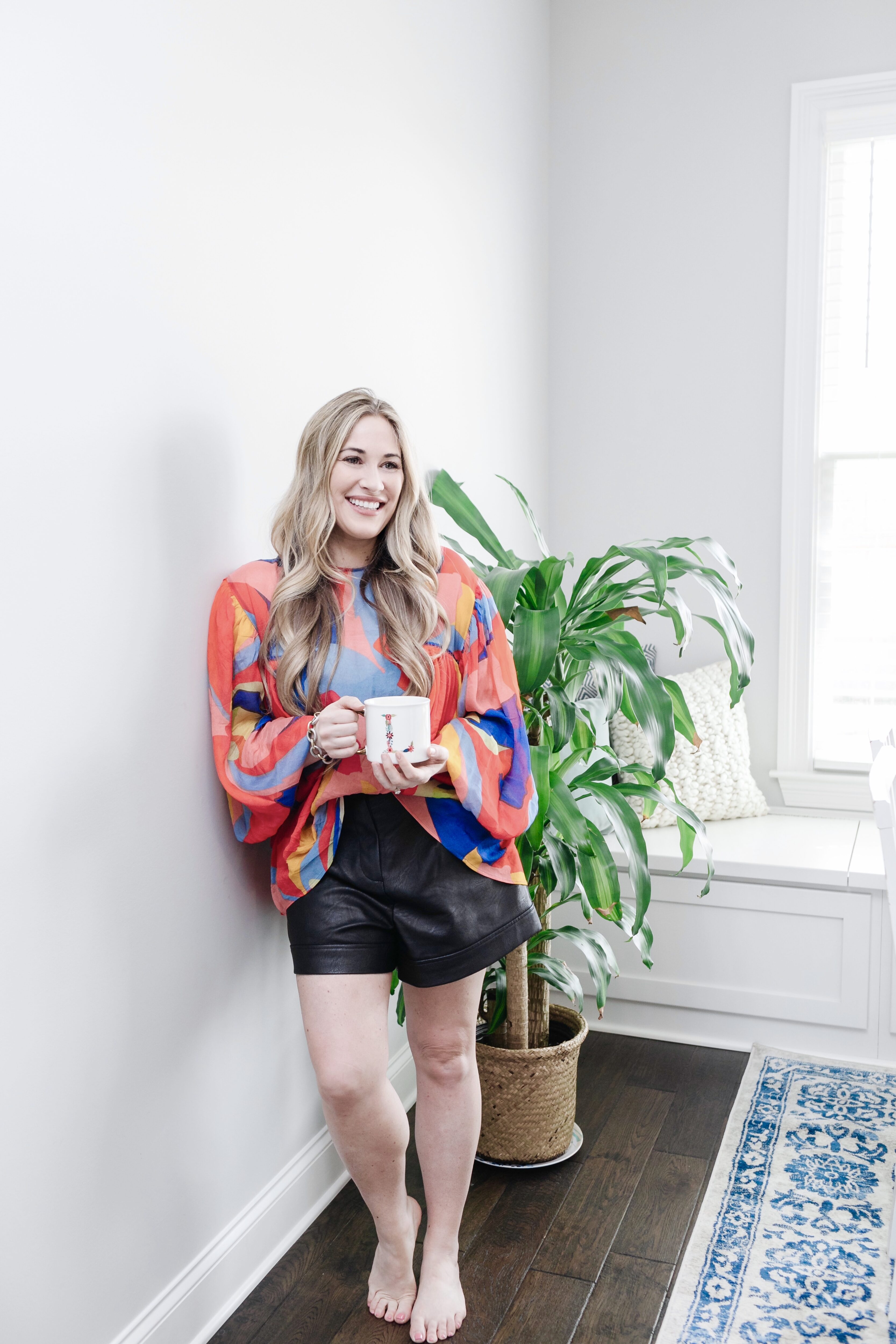 Best Flattering Shorts to Wear this Spring featured by top Memphis fashion blogger, Walking in Memphis in High Heels: image of a woman wearing Topshop faux leather shorts.