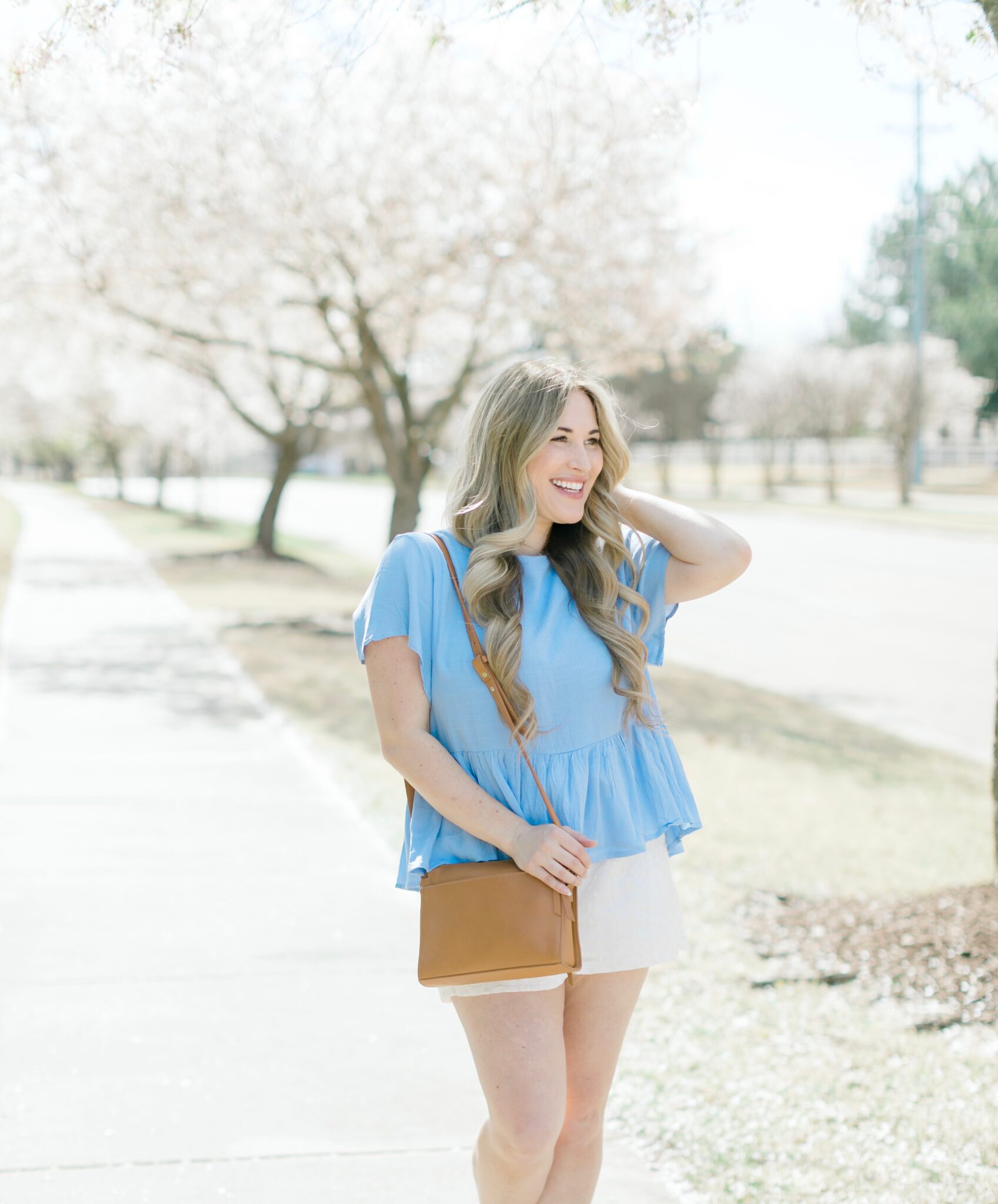 Cute spring shorts for women styled by top Memphis fashion blogger, Walking in Memphis in High Heels: image of a woman wearing Altar'd State shorts