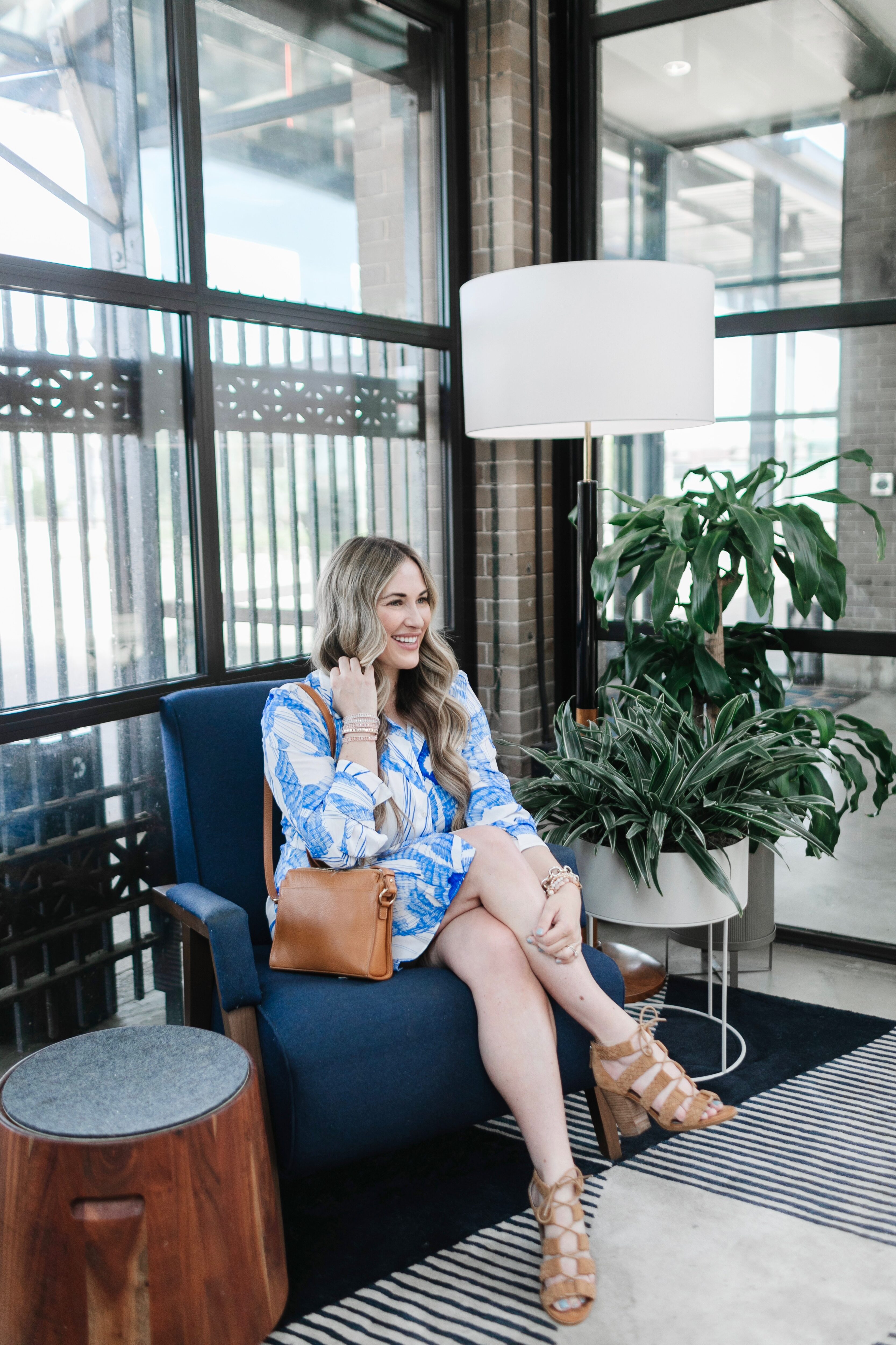 Cute spring dresses and skirts featured by top Memphis fashion blogger, Walking in Memphis in High Heels: image of a woman wearing a Robert Graham shirt dress.