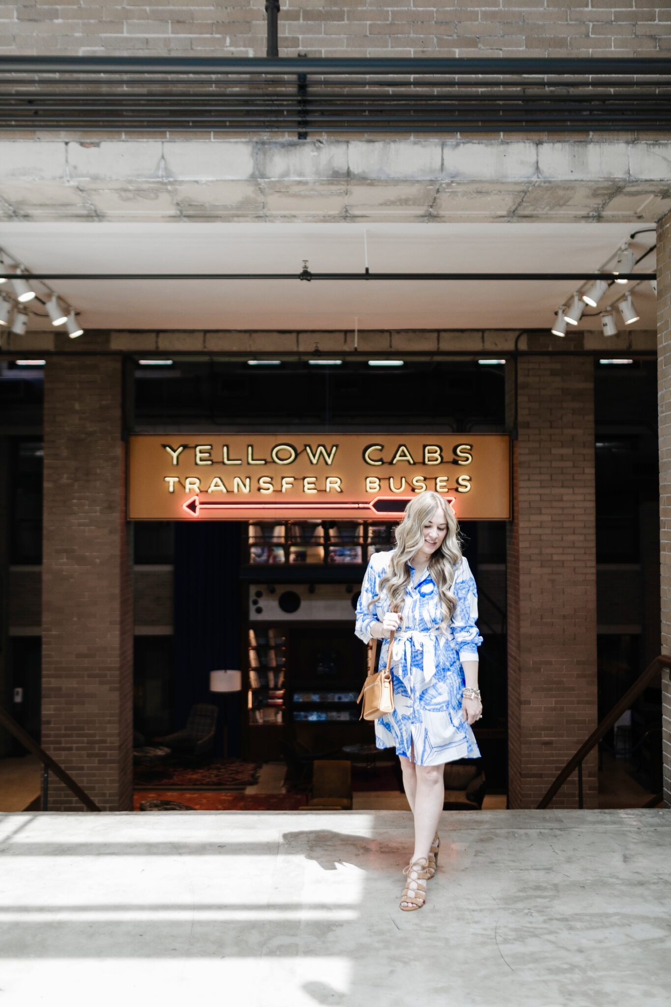 Cute spring dresses and skirts featured by top Memphis fashion blogger, Walking in Memphis in High Heels: image of a woman wearing a Robert Graham shirt dress.