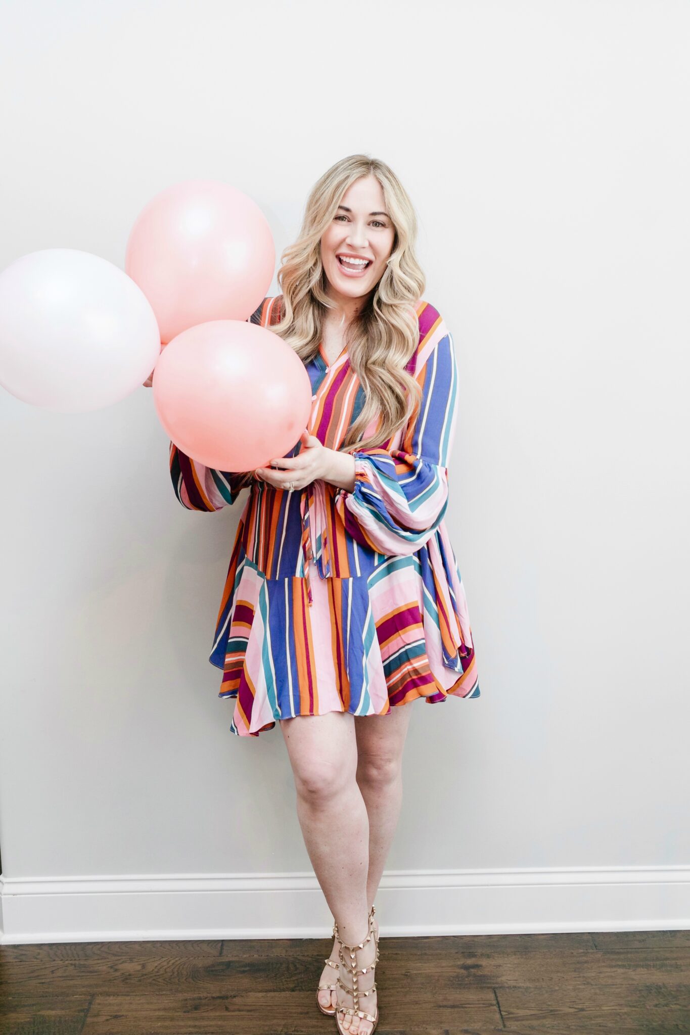 Cute Summer Cookout Outfits featured by top Memphis fashion blogger, Walking in Memphis in High Heels: image of a woman wearing a Red Dress Boutique rainbow dress.