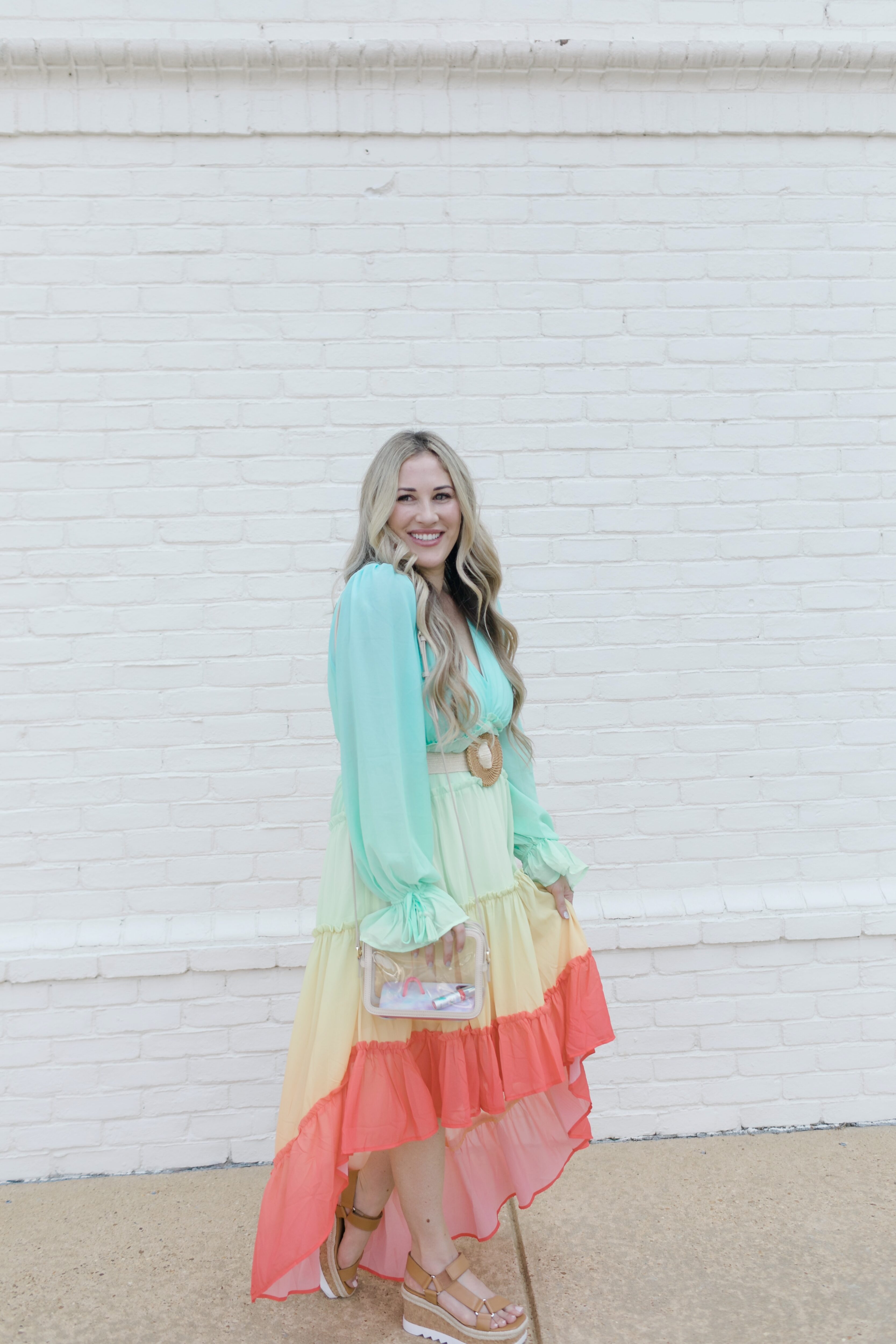 Summer maxi dresses with sleeves styled by top US fashion blogger, Walking in Memphis in High Heels: image of a woman wearing a Red Dress High Low maxi dress