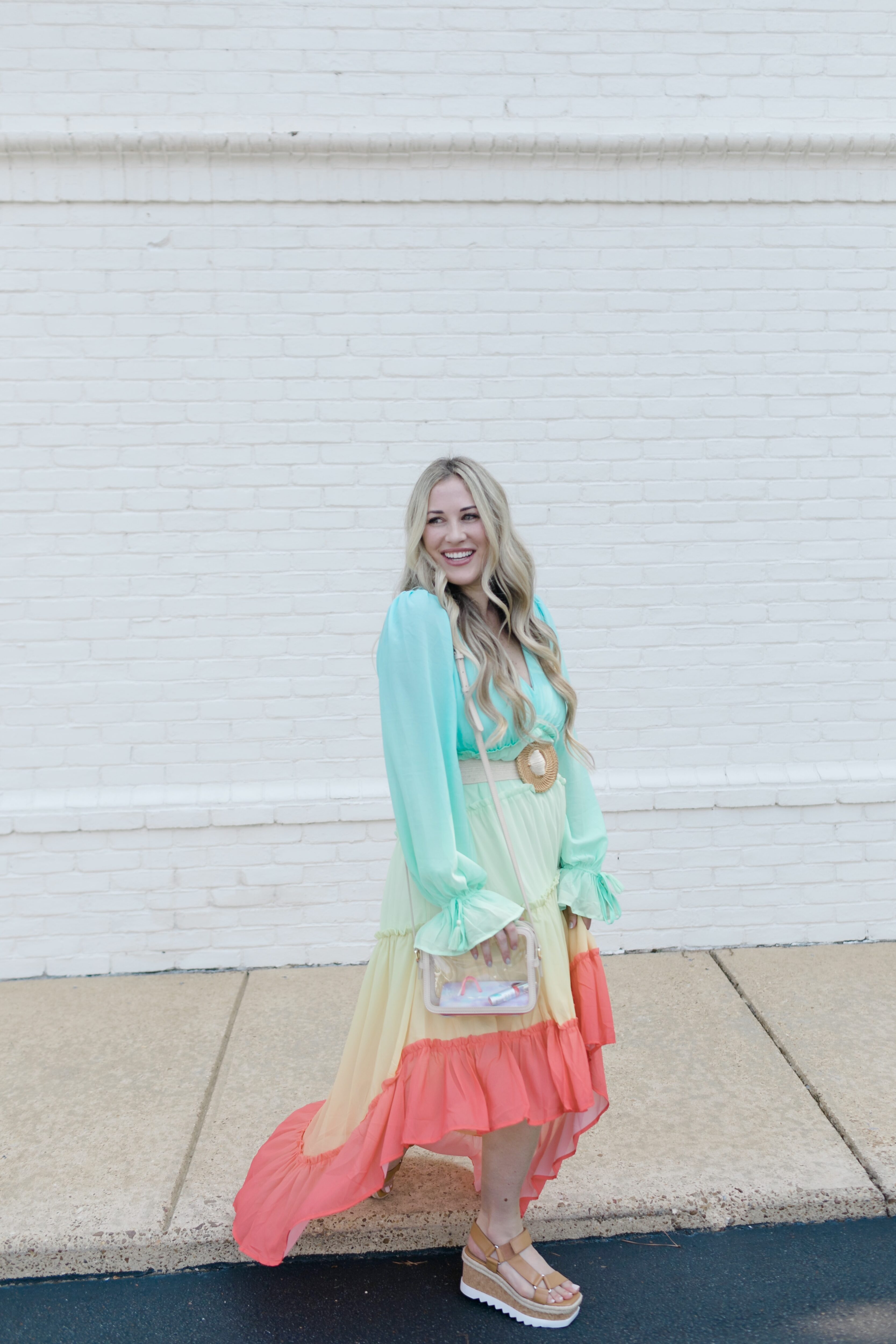 Summer maxi dresses with sleeves styled by top US fashion blogger, Walking in Memphis in High Heels: image of a woman wearing a Red Dress High Low maxi dress