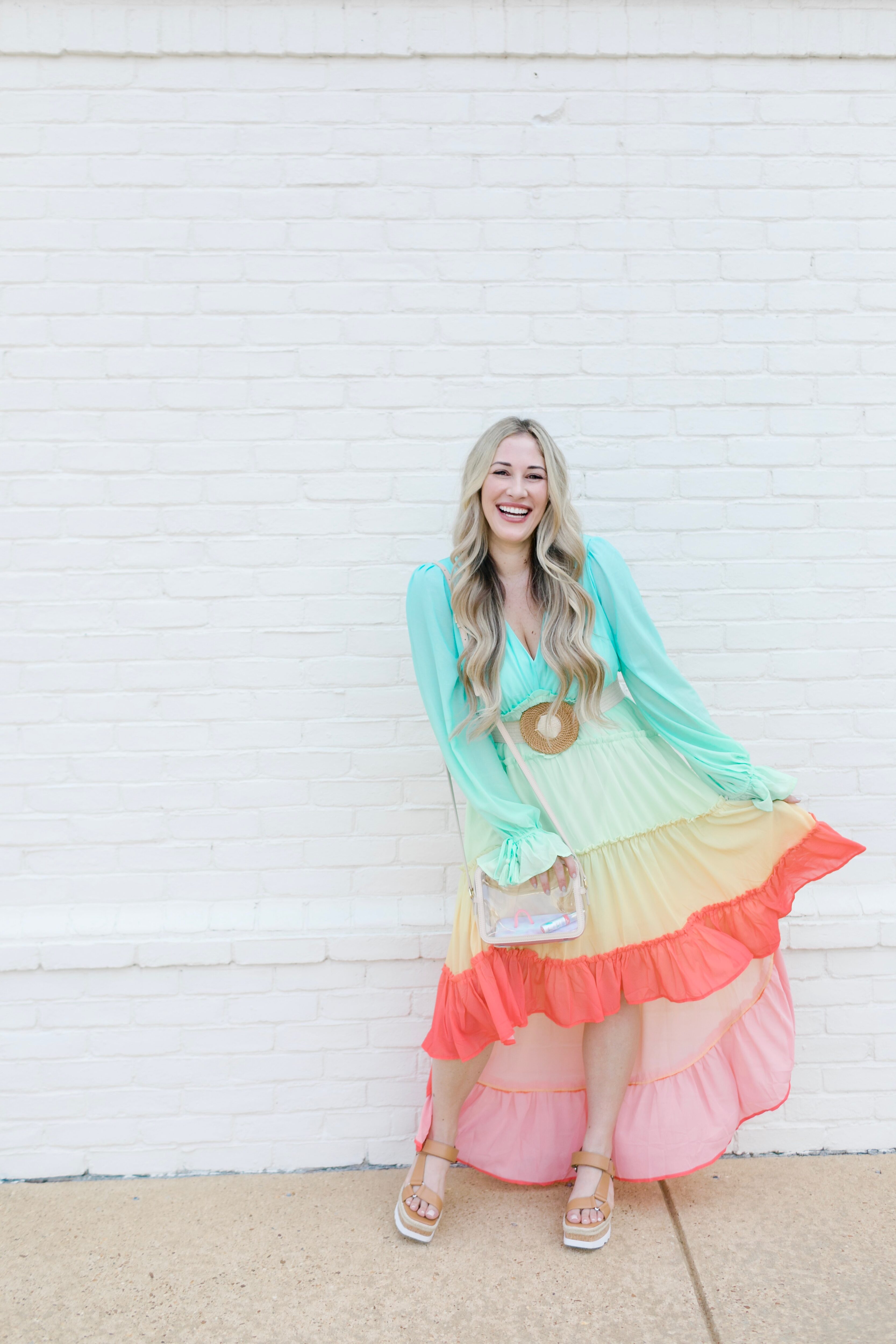 Summer maxi dresses with sleeves styled by top US fashion blogger, Walking in Memphis in High Heels: image of a woman wearing a Red Dress High Low maxi dress