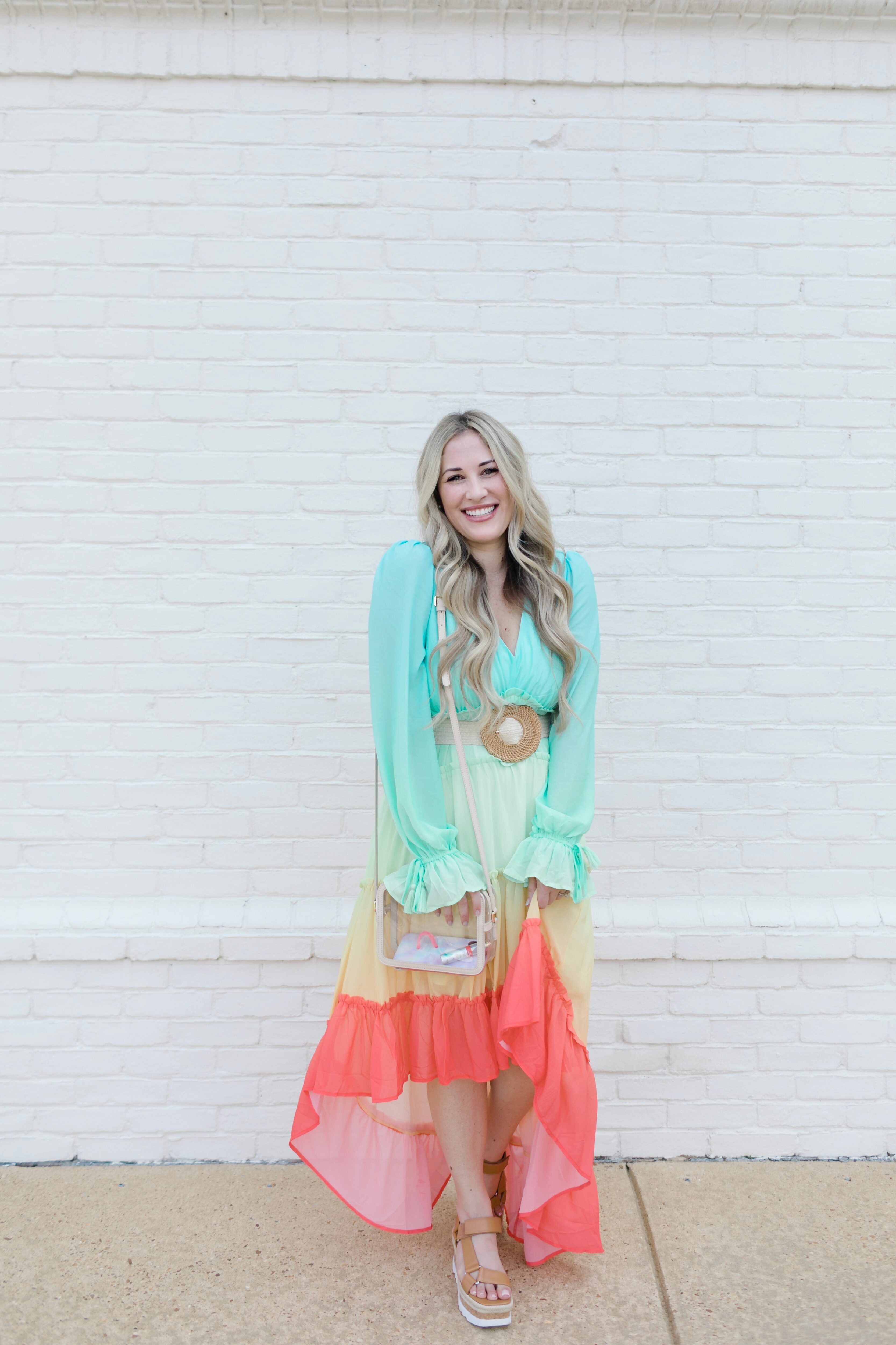 Summer maxi dresses with sleeves styled by top US fashion blogger, Walking in Memphis in High Heels: image of a woman wearing a Red Dress High Low maxi dress