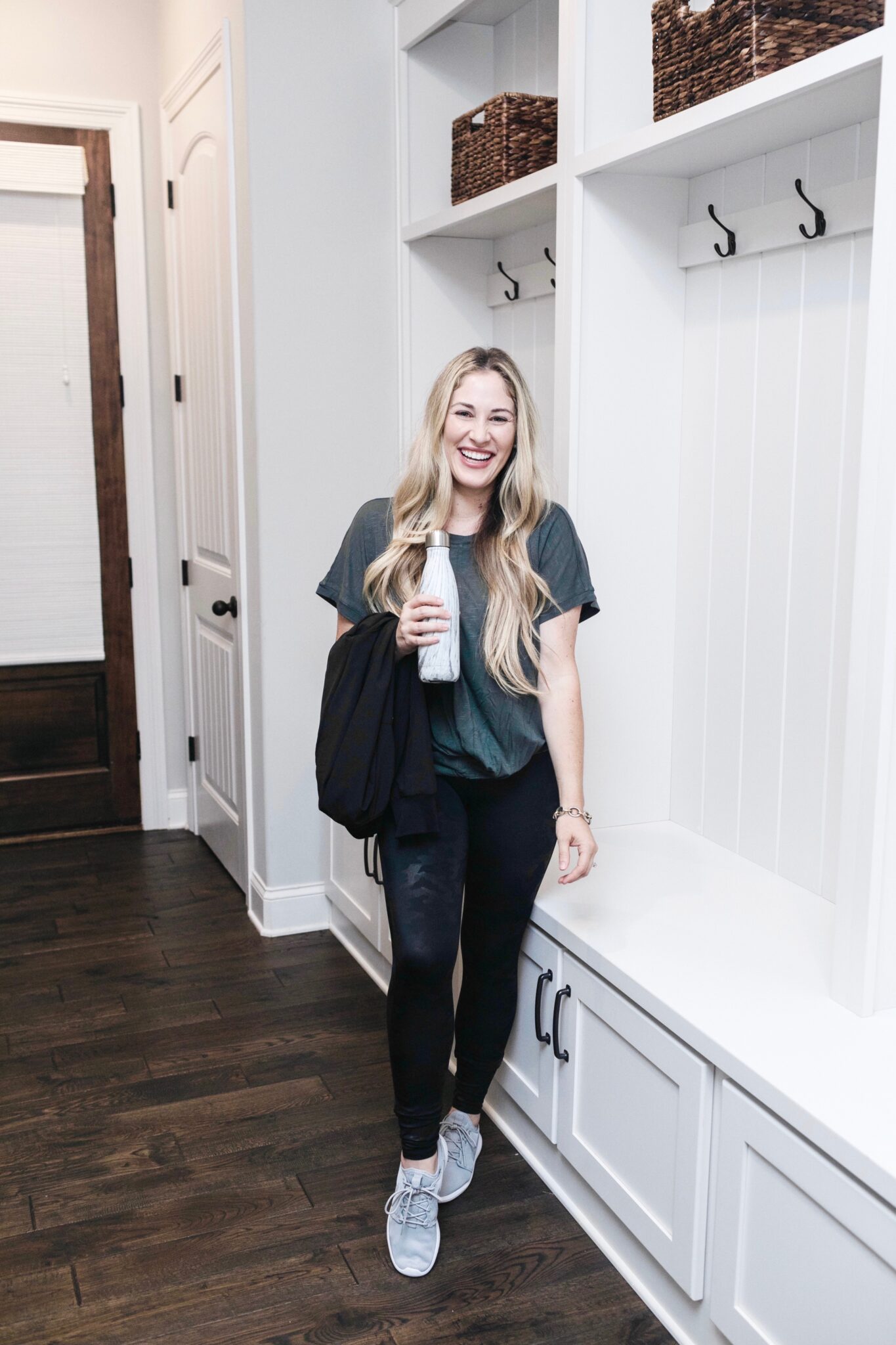 Athleisurewear for moms featured by top US fitness blogger, Walking in Memphis in High Heels: image of a woman wearing A Soma tunic, Spanx faux leather camouflage leggings, and Adidas Swift Run X Sneakers