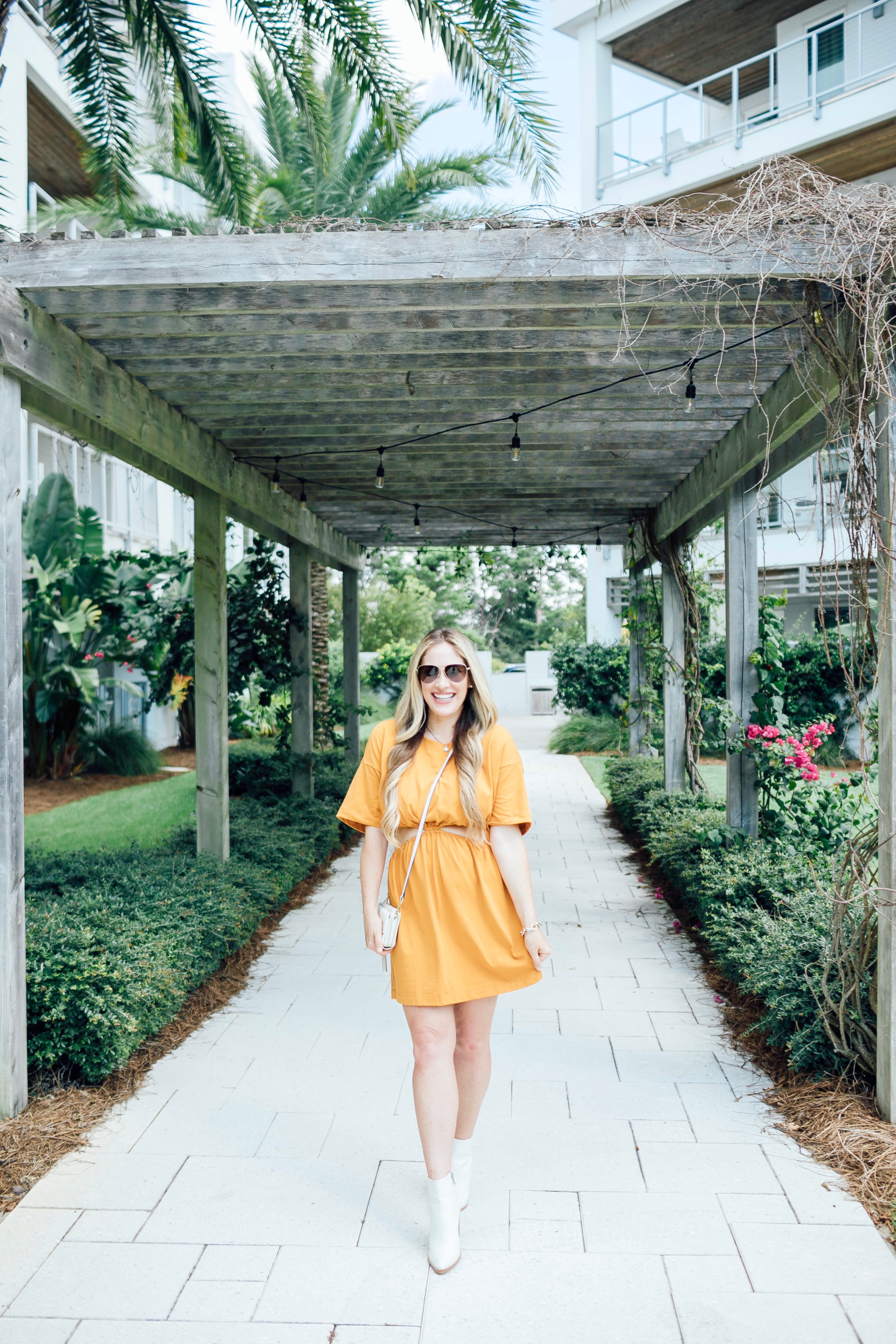 Summer to fall look featured by top US mom fashion blogger, Walking in Memphis in High Heels: image of a woman wearing a yellow Free People dress and Marc Fisher white booties.