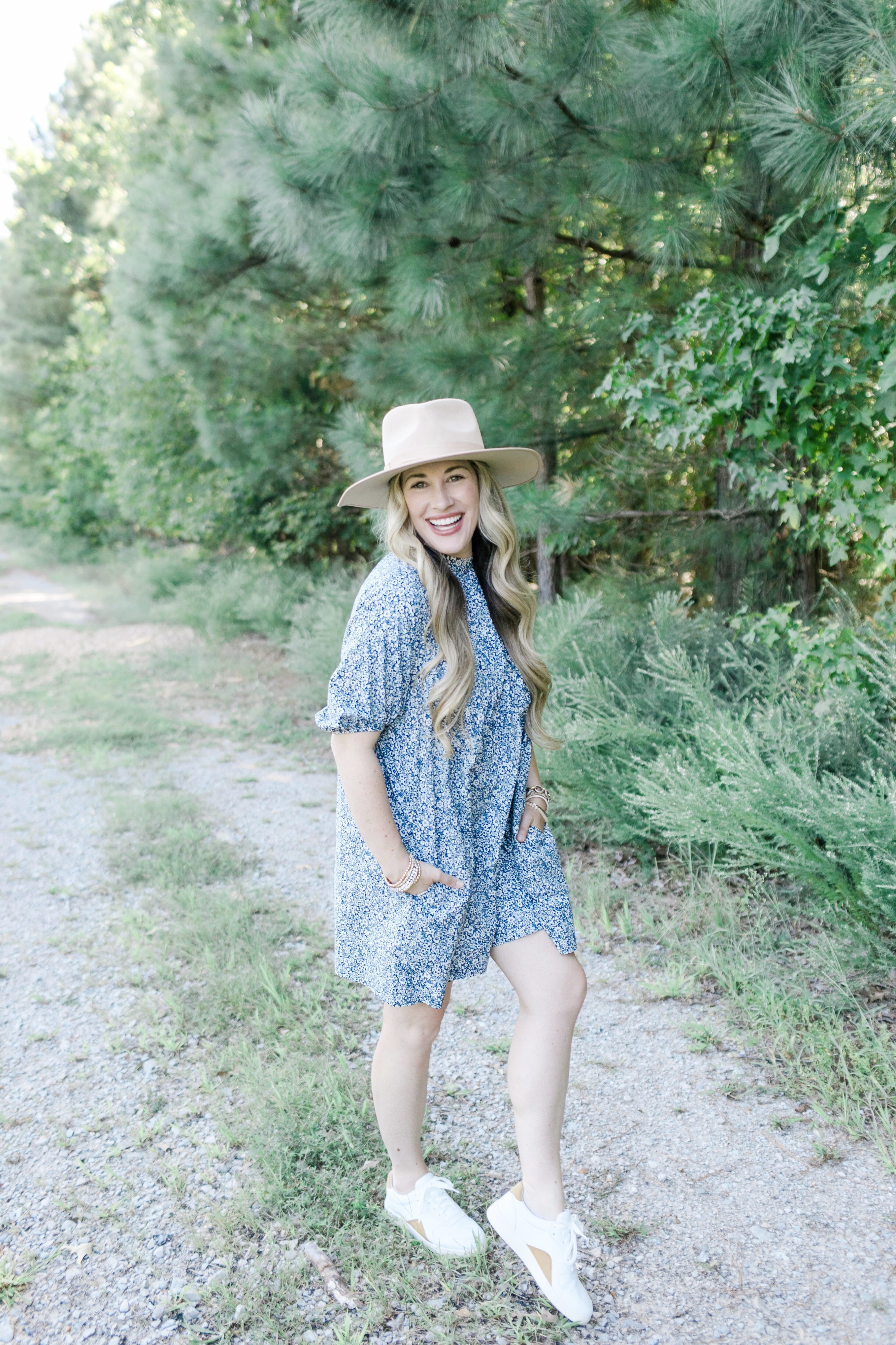 Fall floral dress styled by top US mom fashion blogger, Walking in Memphis in High Heels: image of a woman wearing an Everlane navy blue floral mini dress.