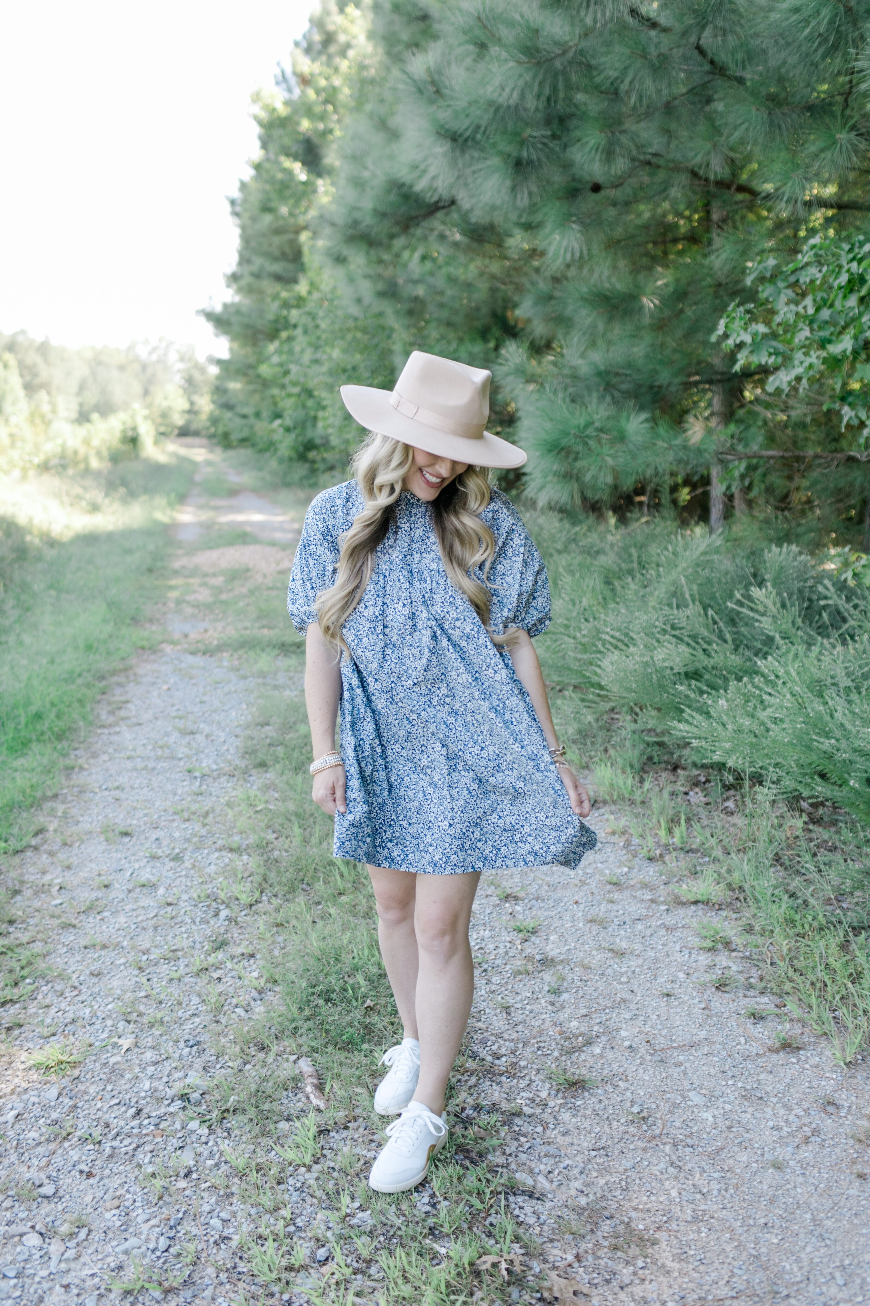 Fall floral dress styled by top US mom fashion blogger, Walking in Memphis in High Heels: image of a woman wearing an Everlane navy blue floral mini dress.