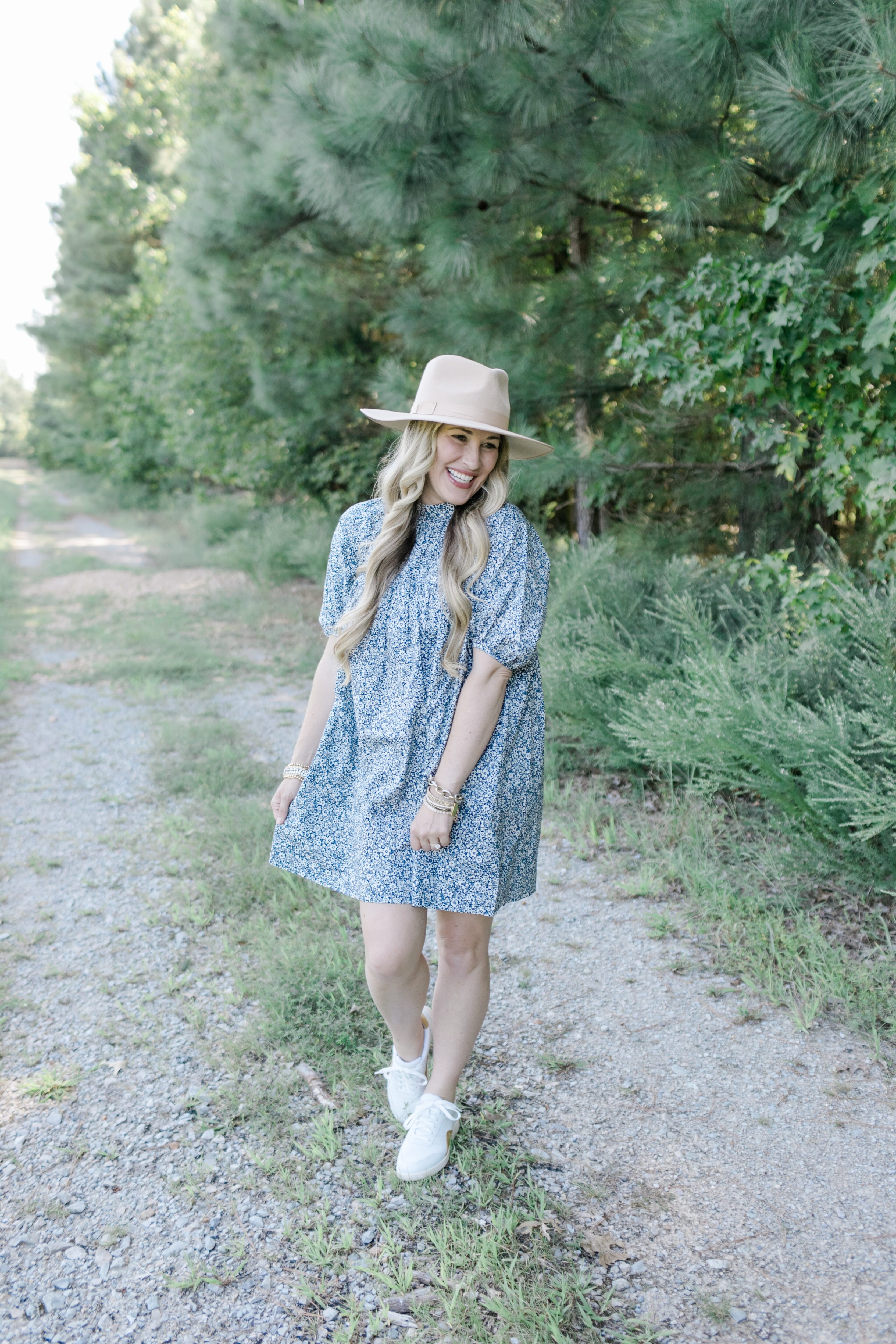 Fall floral dress styled by top US mom fashion blogger, Walking in Memphis in High Heels: image of a woman wearing an Everlane navy blue floral mini dress.