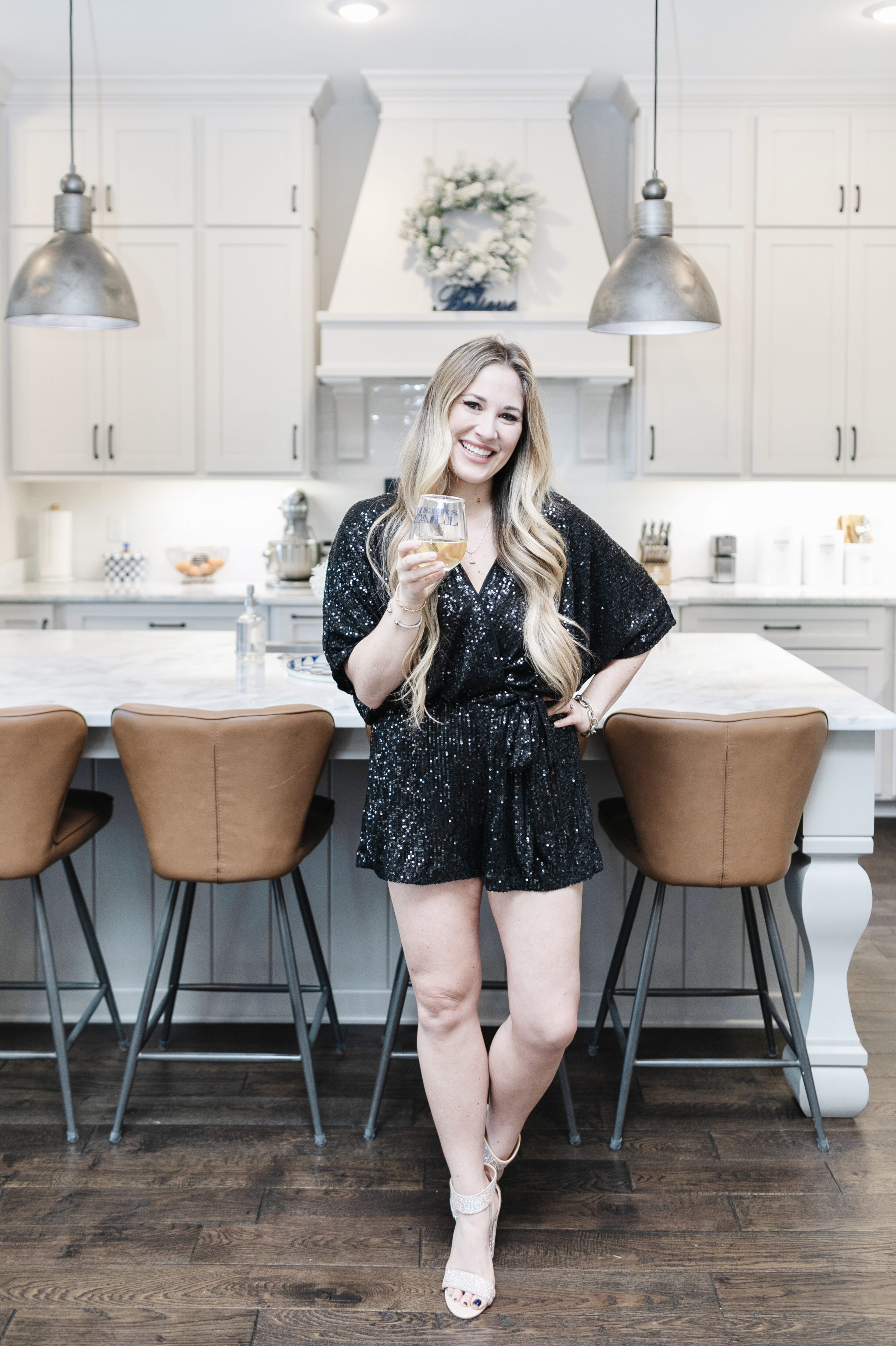 Red Dress Sequin Romper styled for the Holidays by top US mom fashion blogger, Walking in Memphis in High Heels.