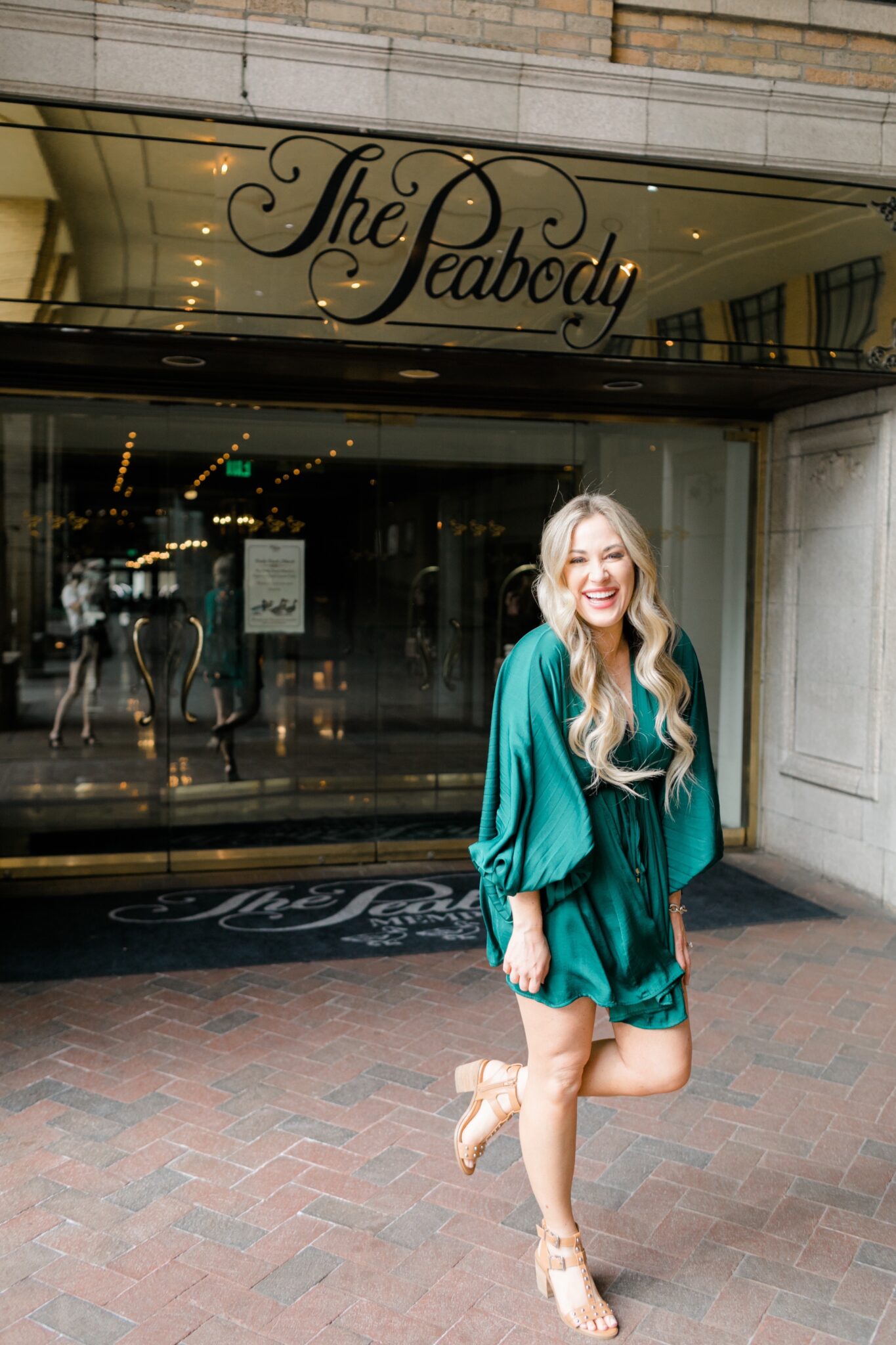 mother's day giveaway outfit: girl in green dress at Peabody hotel
